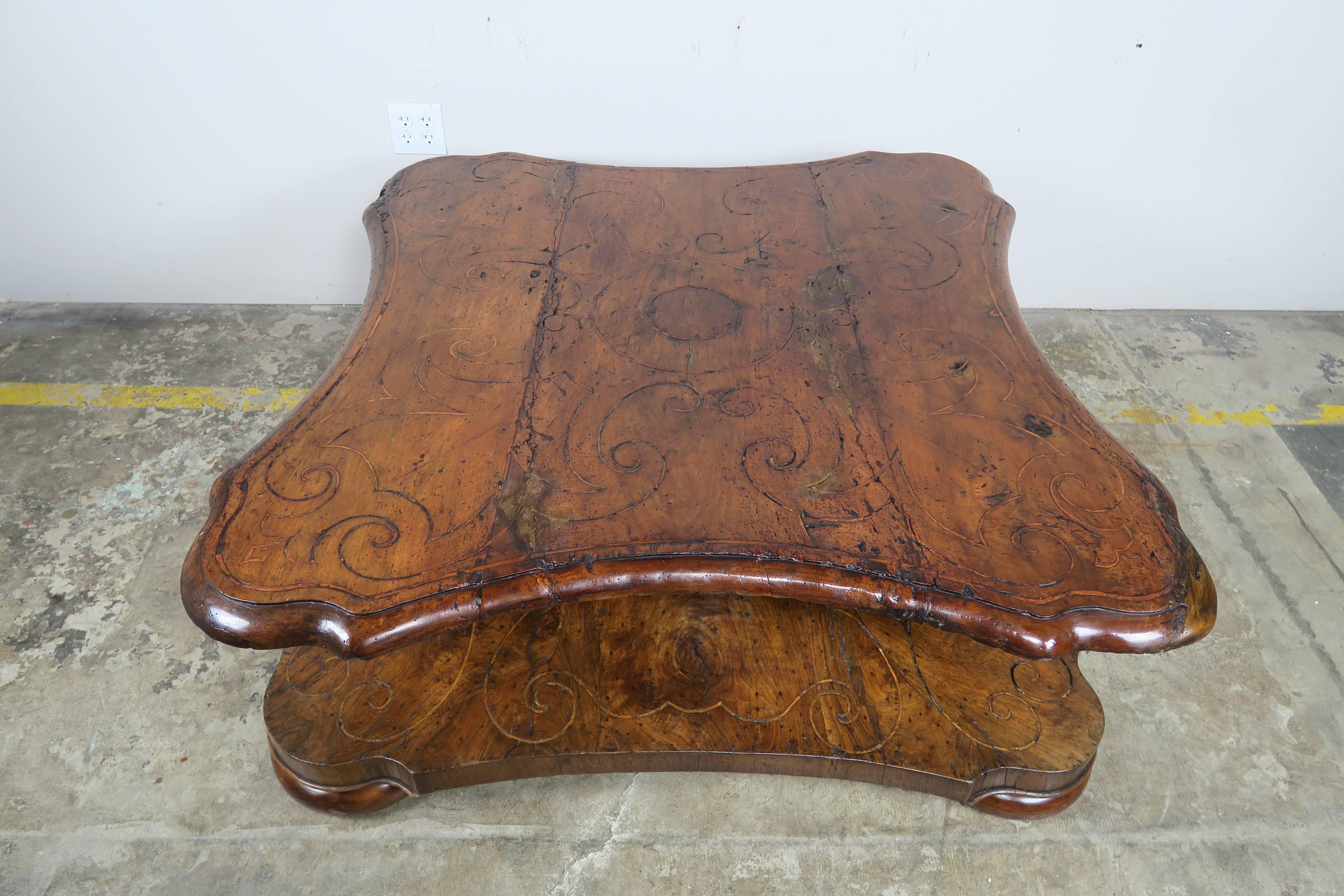 18th century, Italian inlaid walnut square shaped scalloped coffee table standing on four bun feet.