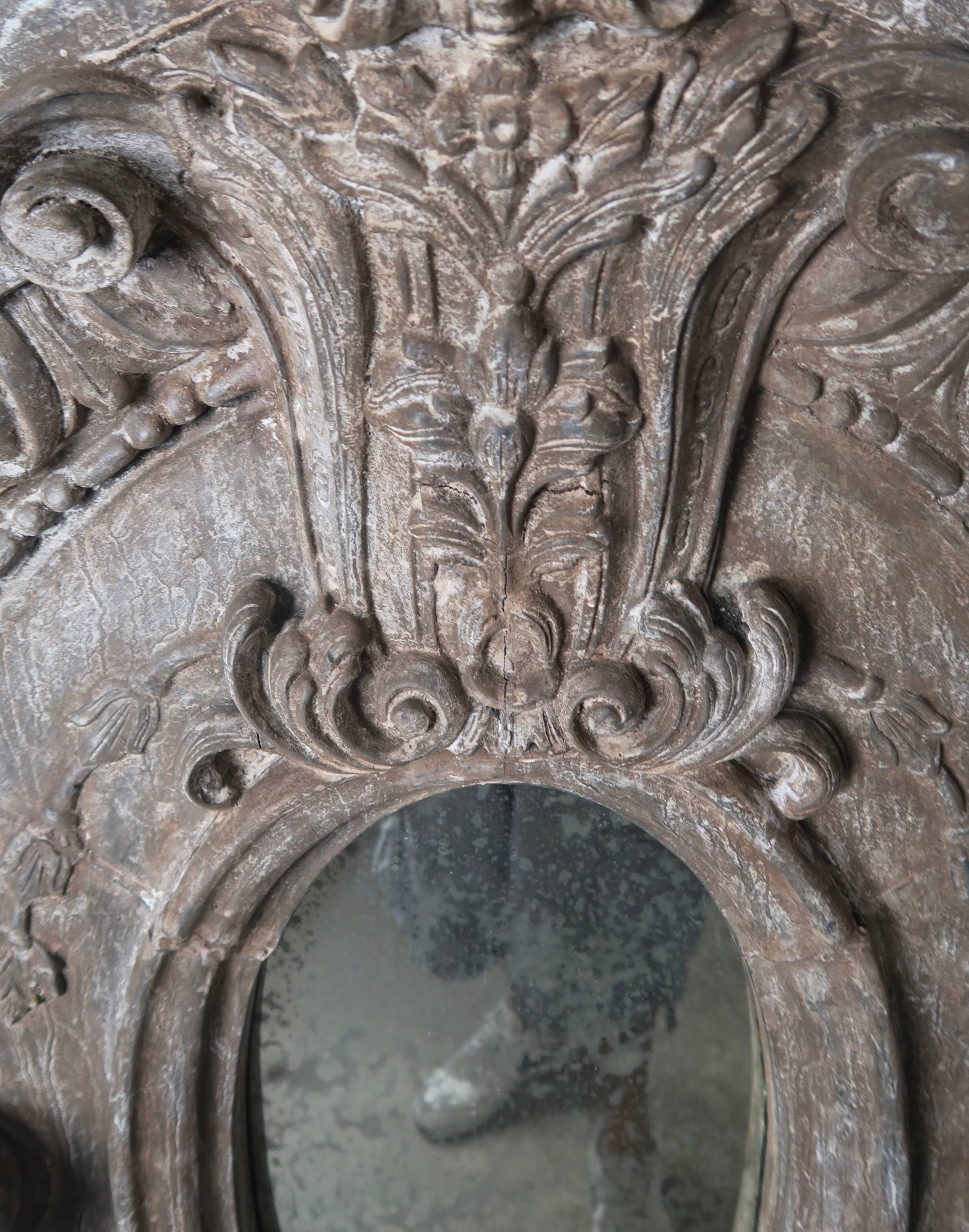 Swedish carved grey painted mirror with egg and dart detailing and beautiful carved centre design. Antiqued mirror inset.