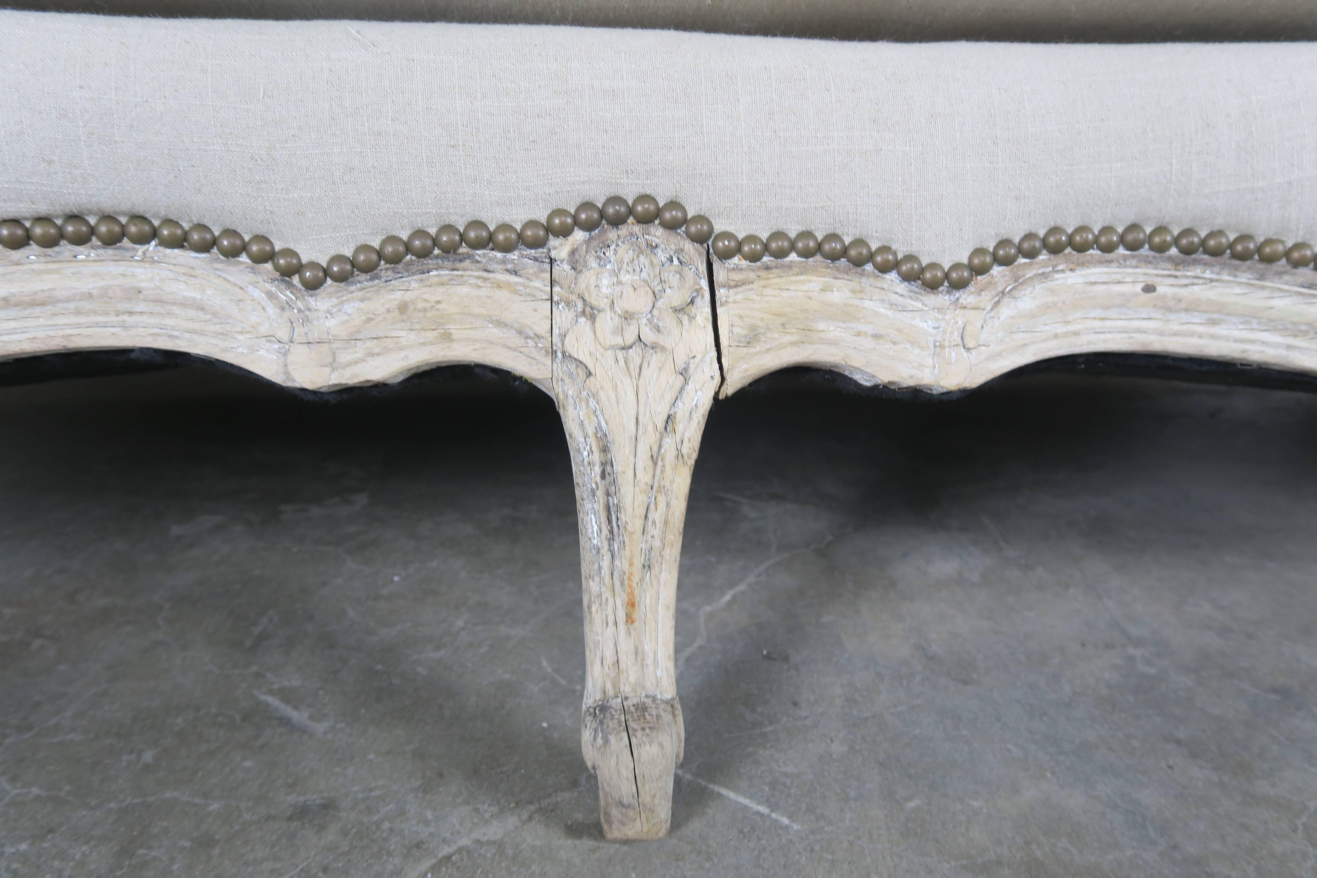 19th Century French Natural Carved Wood Sofa with Linen Upholstery In Distressed Condition In Los Angeles, CA