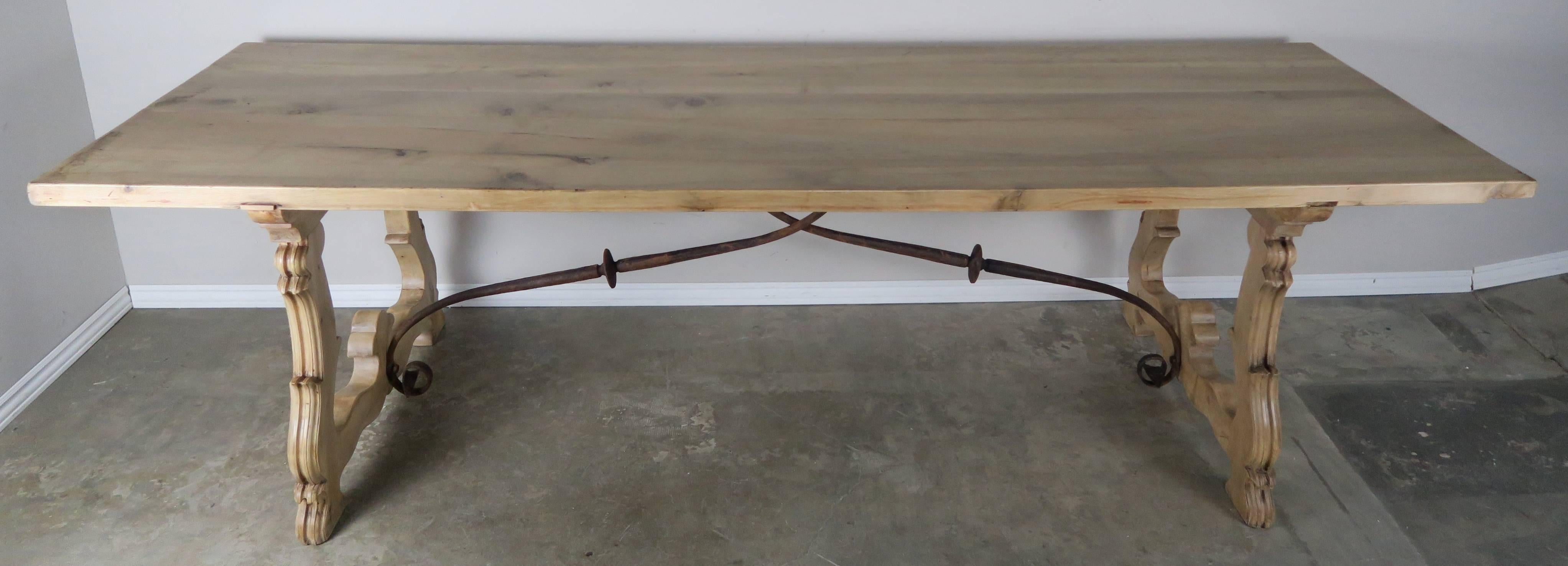 We are offering this Spanish Baroque style walnut refectory table with lyre or harp form supports and original iron stretchers. A refectory table is a long narrow table supported by heavy legs or trestles connected by stretchers, used originally for