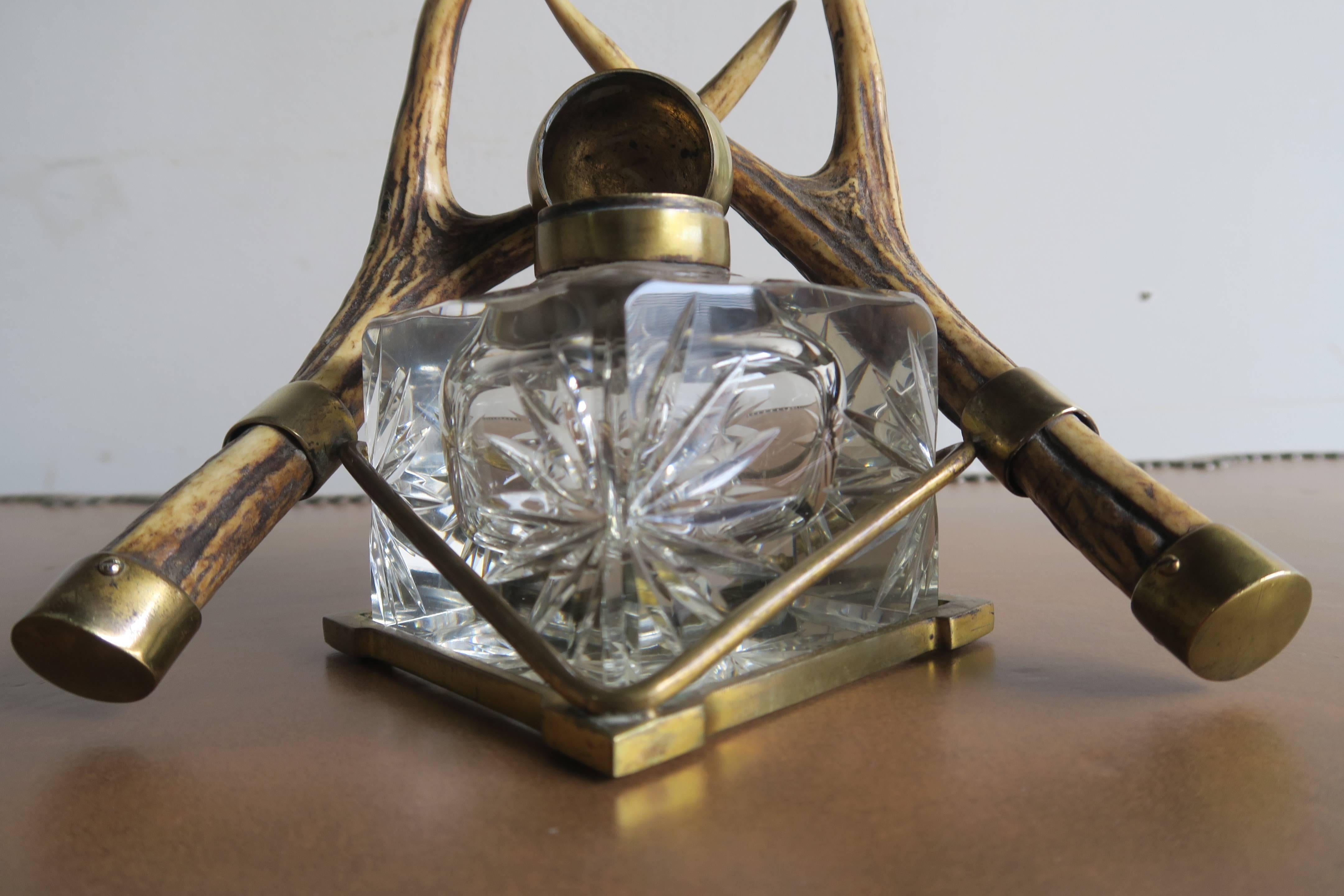Rare 19th century English inkwell on horn and brass base. Crystal ink well with starburst design. Brass top and base.
