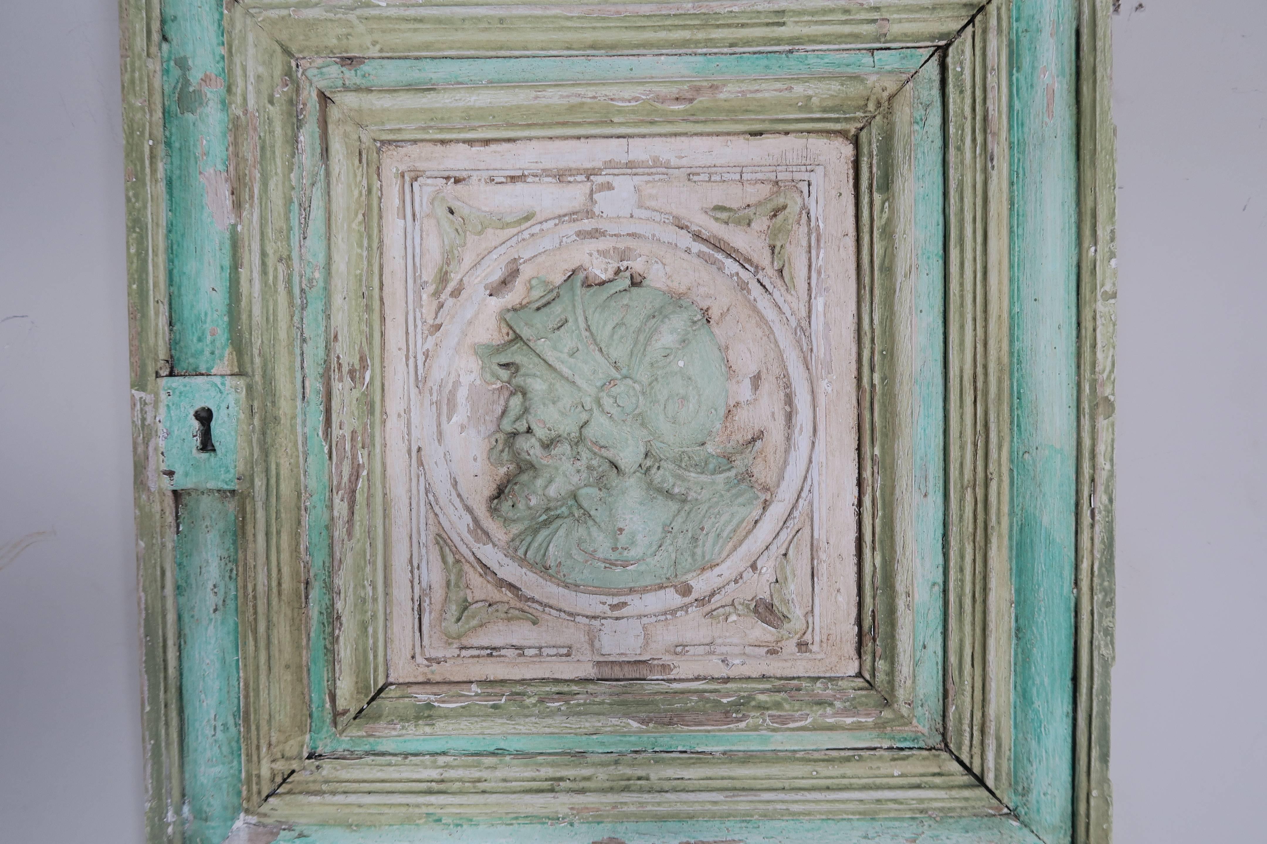 19th century Spanish walnut aqua and cream painted door panel depicting a conquistador.