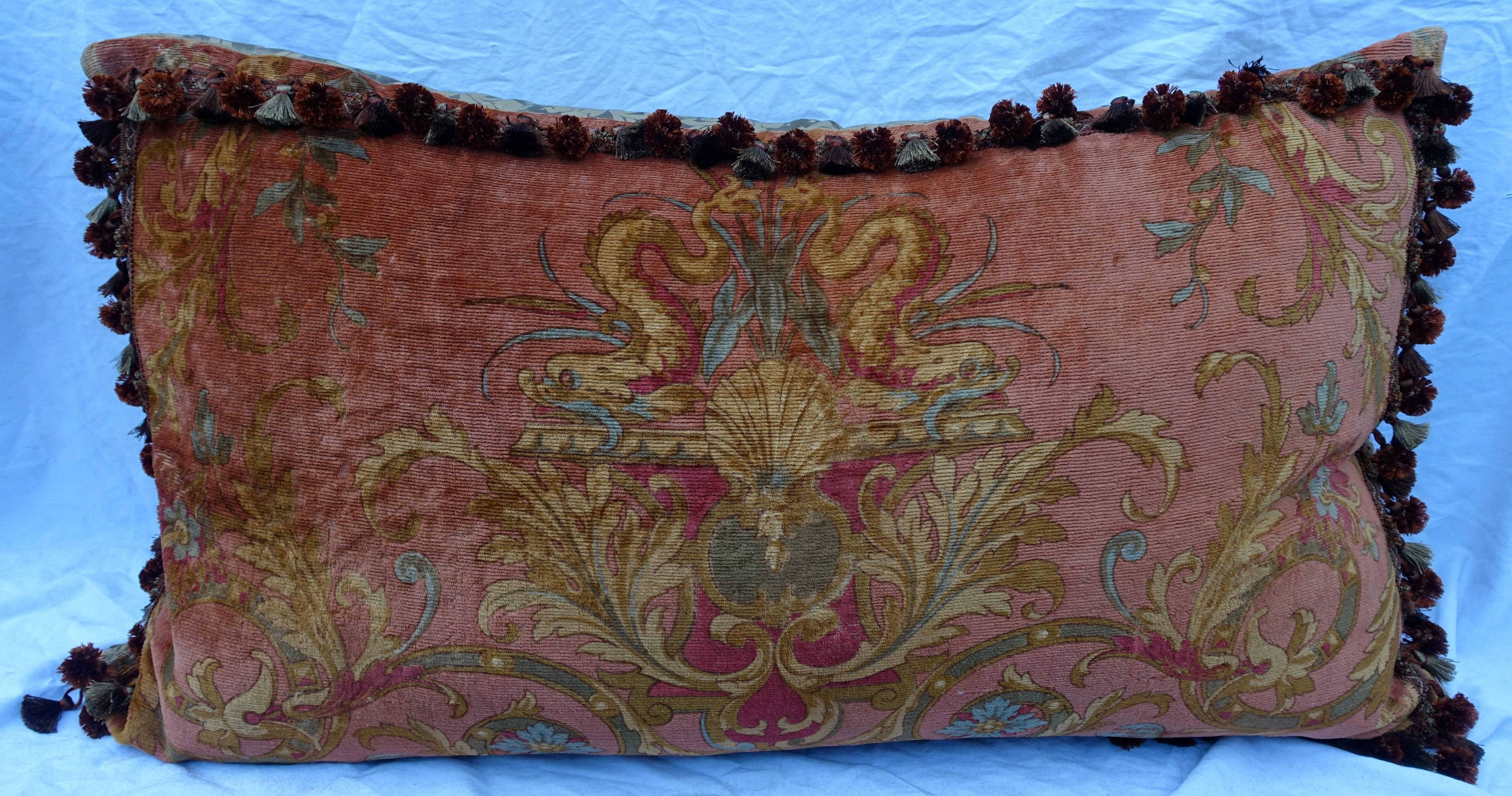 Custom bed pillow by Melissa Levinson made with early 20th century mohair velvet in lucious shades of sienna, rust, terra cotta, gold, blue and greens. The design depicts a pair of dolphins flanking a shell and are surrounded by swirling acanthus