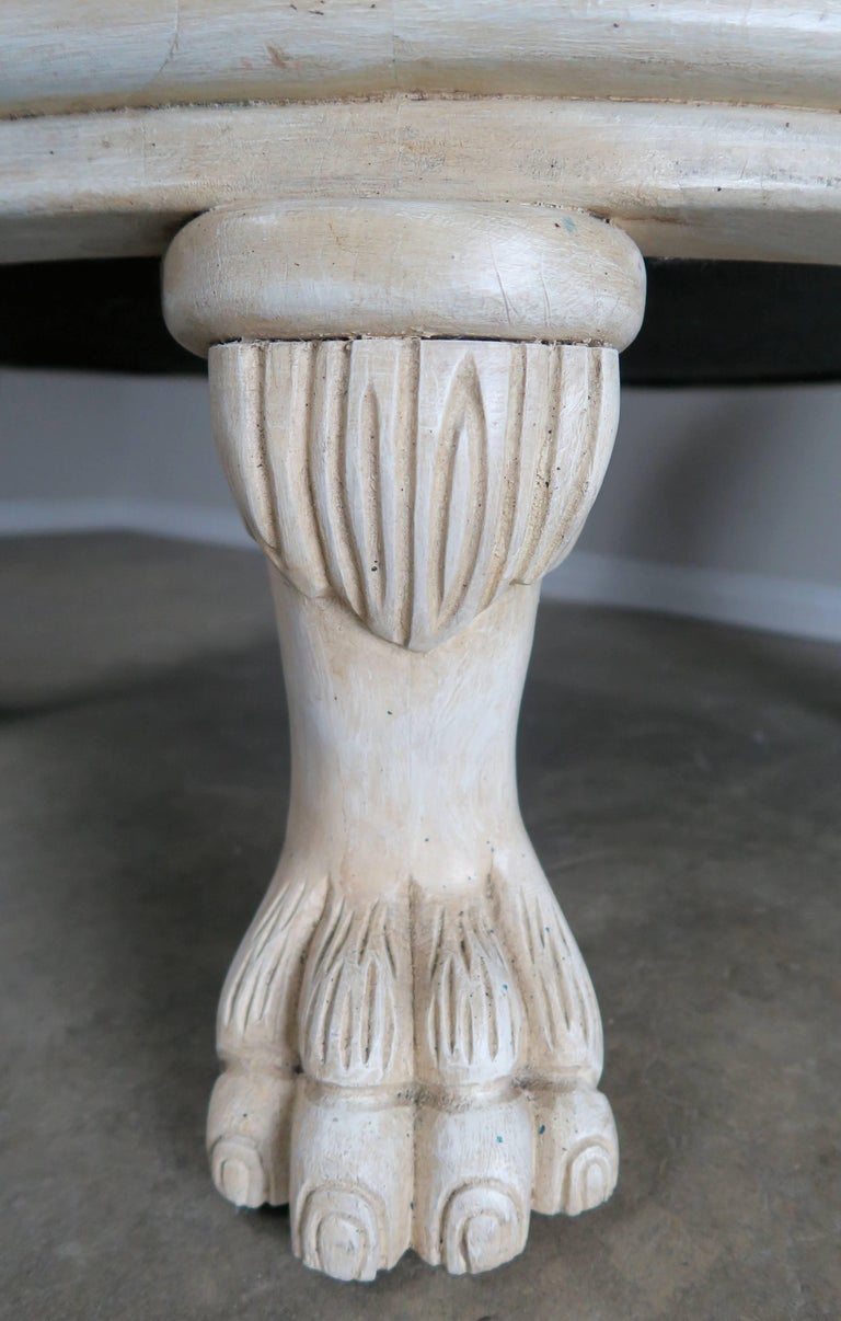 Leather Tufted Round Ottoman with Carved Paw Feet For Sale at 1stdibs