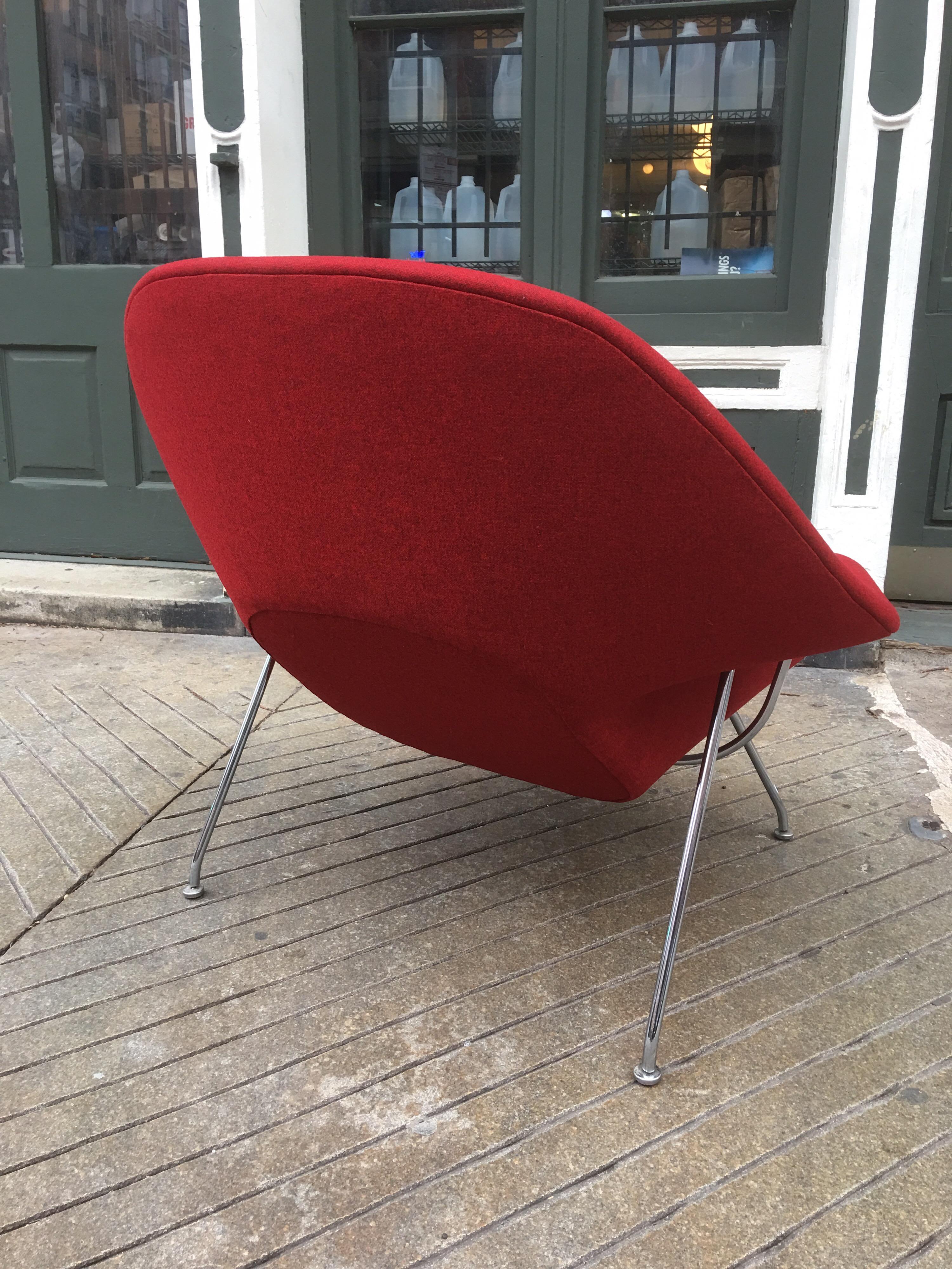 Eero Saarinen Womb chair by Knoll freshly redone in red hop-sack fabric on a stainless steel frame. Bought from original owner who purchased it in early 1960s. Retains old fabric label.