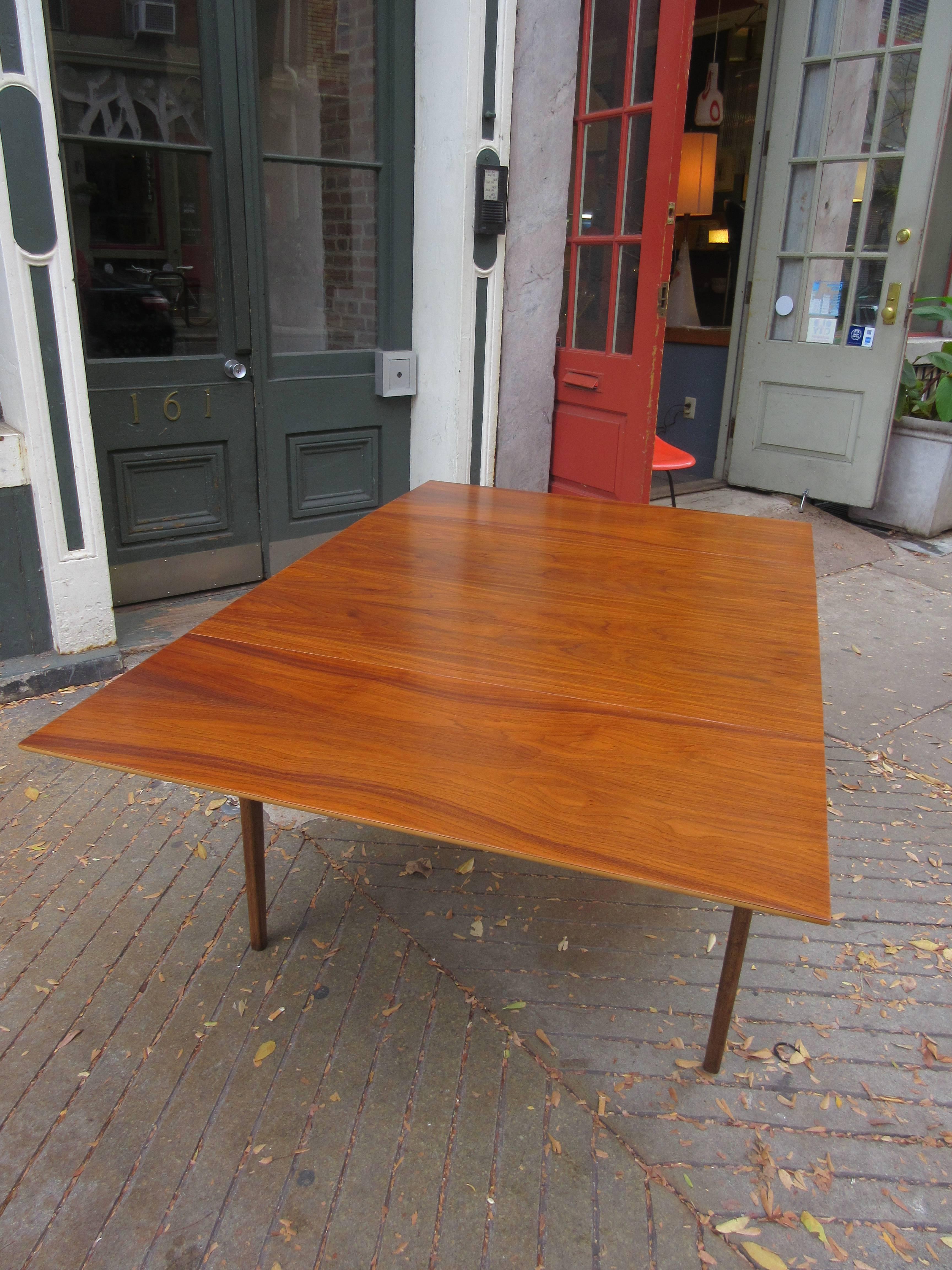 Walnut drop-leaf table with gracefully curved legs. Can seat six-eight very comfortably. Table is 42 x 33 when the leaves are dropped. Measurements given are the table with both leaves extended.