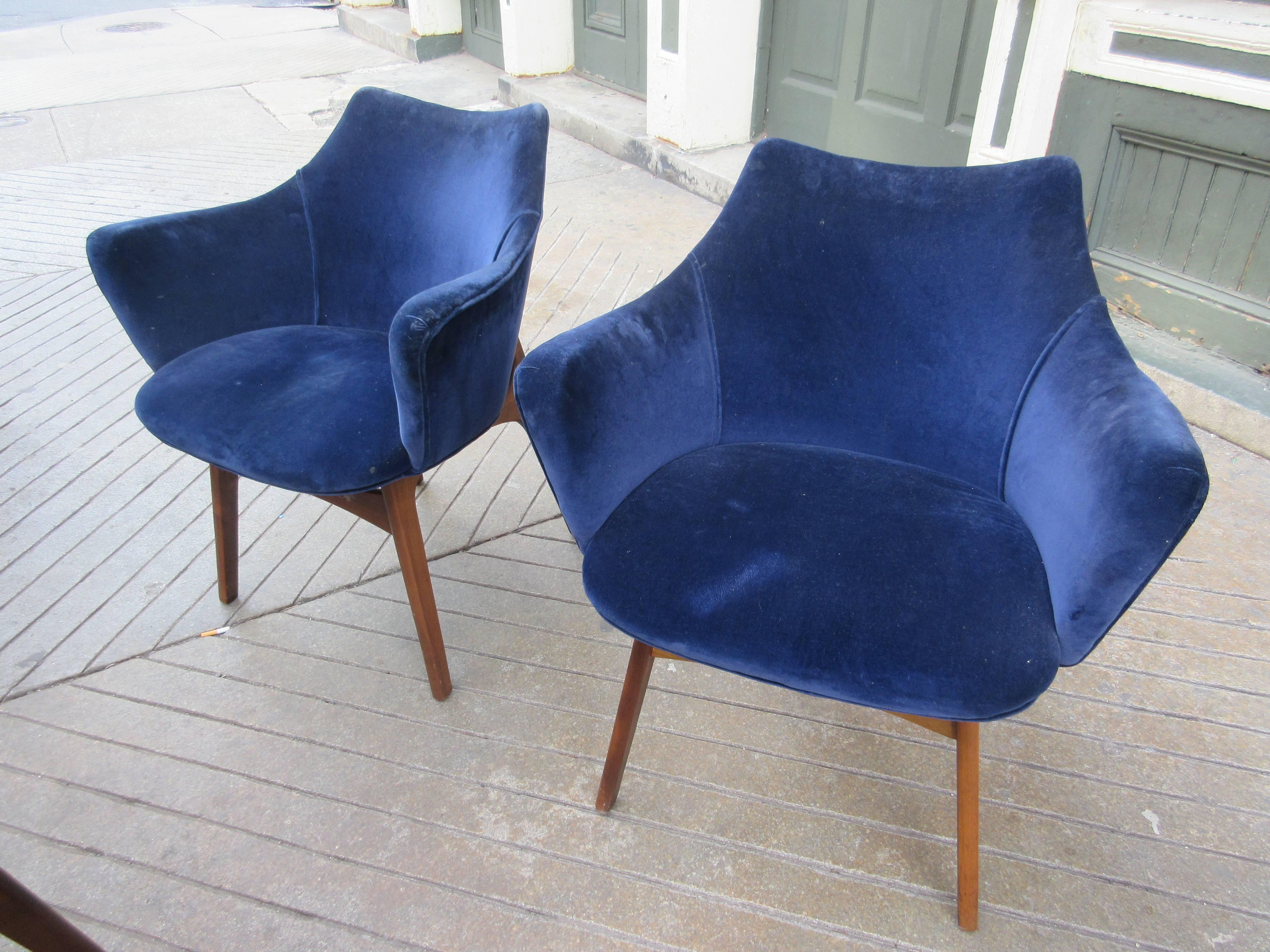 Hard to find set of six dining chairs. Two-arm and four side chairs in their original dark blue velvet. Walnut frames with and an unique wood back support.  Chairs are solid but need to be reupholstered. Measurements below are for side chairs. Armed