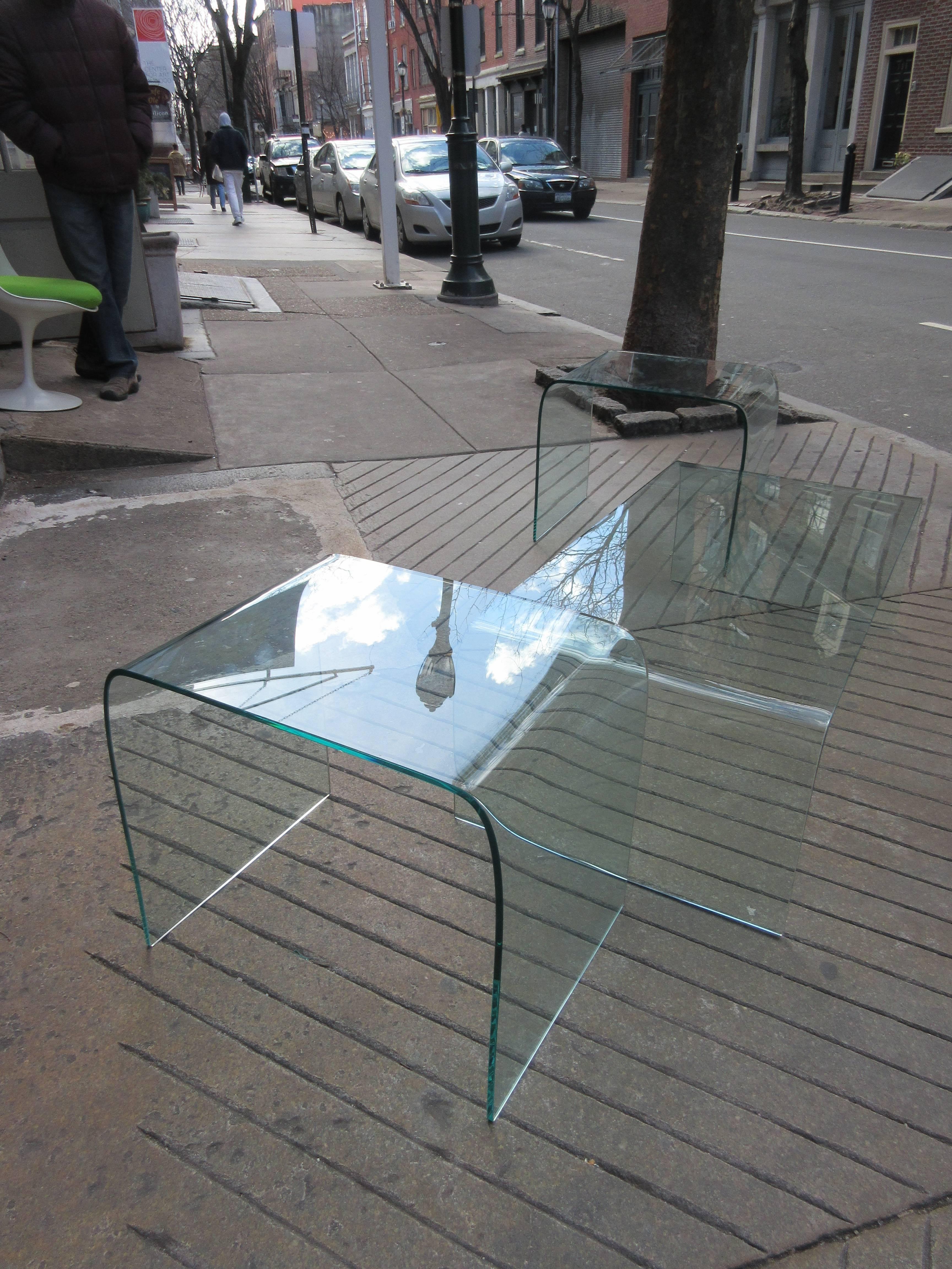 Coffee and matching end tables. We are willing to separate. Waterfall bent glass allows for this one material table to function. Beautiful in its simplicity. End table dimension is 17.75 wide x 23.75 long x 20 high. Coffee dimensions listed below.