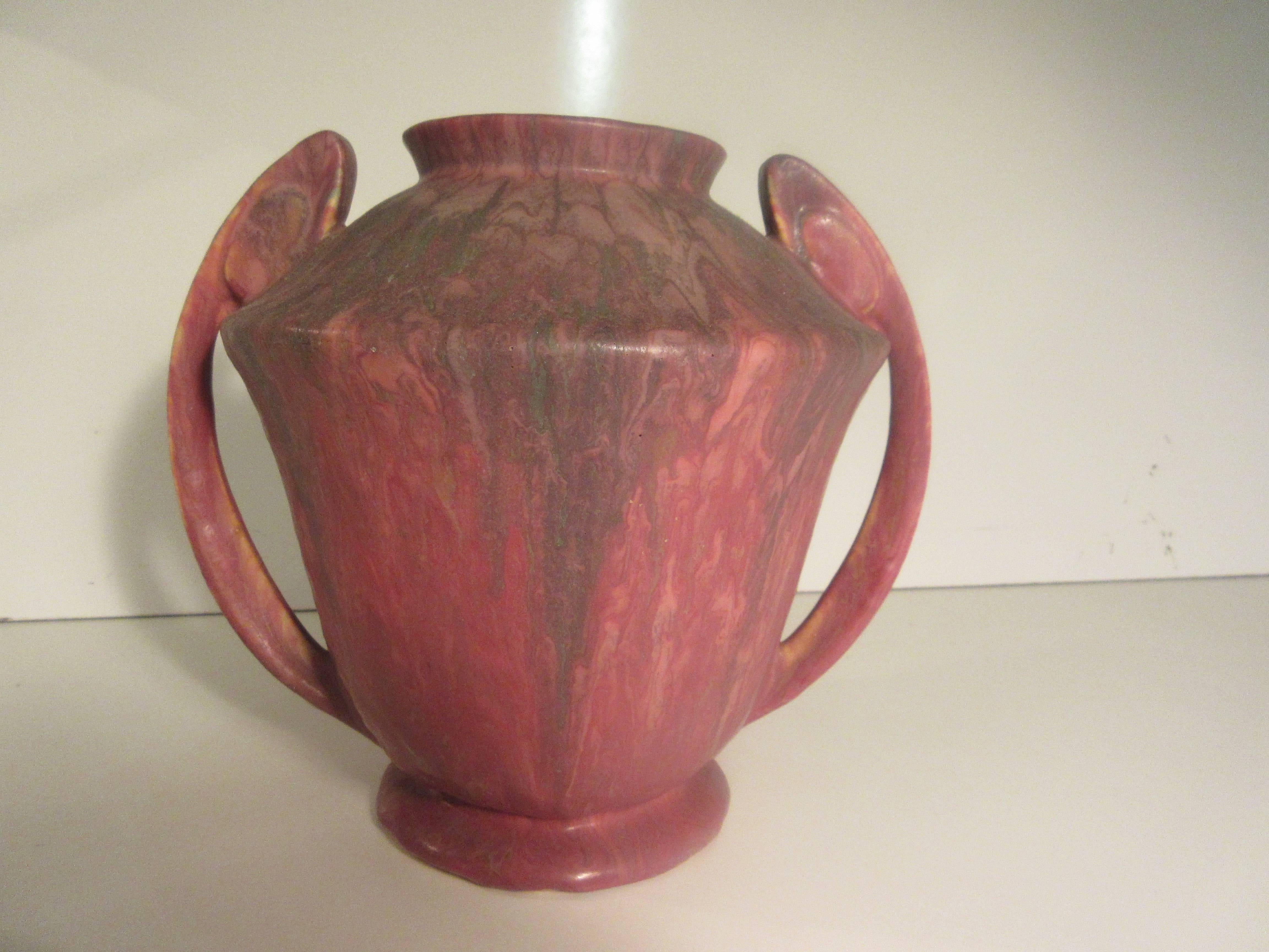 Four pieces offered separately of Roseville Carnelian glazed pottery. This pattern was first made in 1926. We are offering four of the 103 shapes that were offered. The tallest of the four has a factory drilled hole to enable it to be wired as a