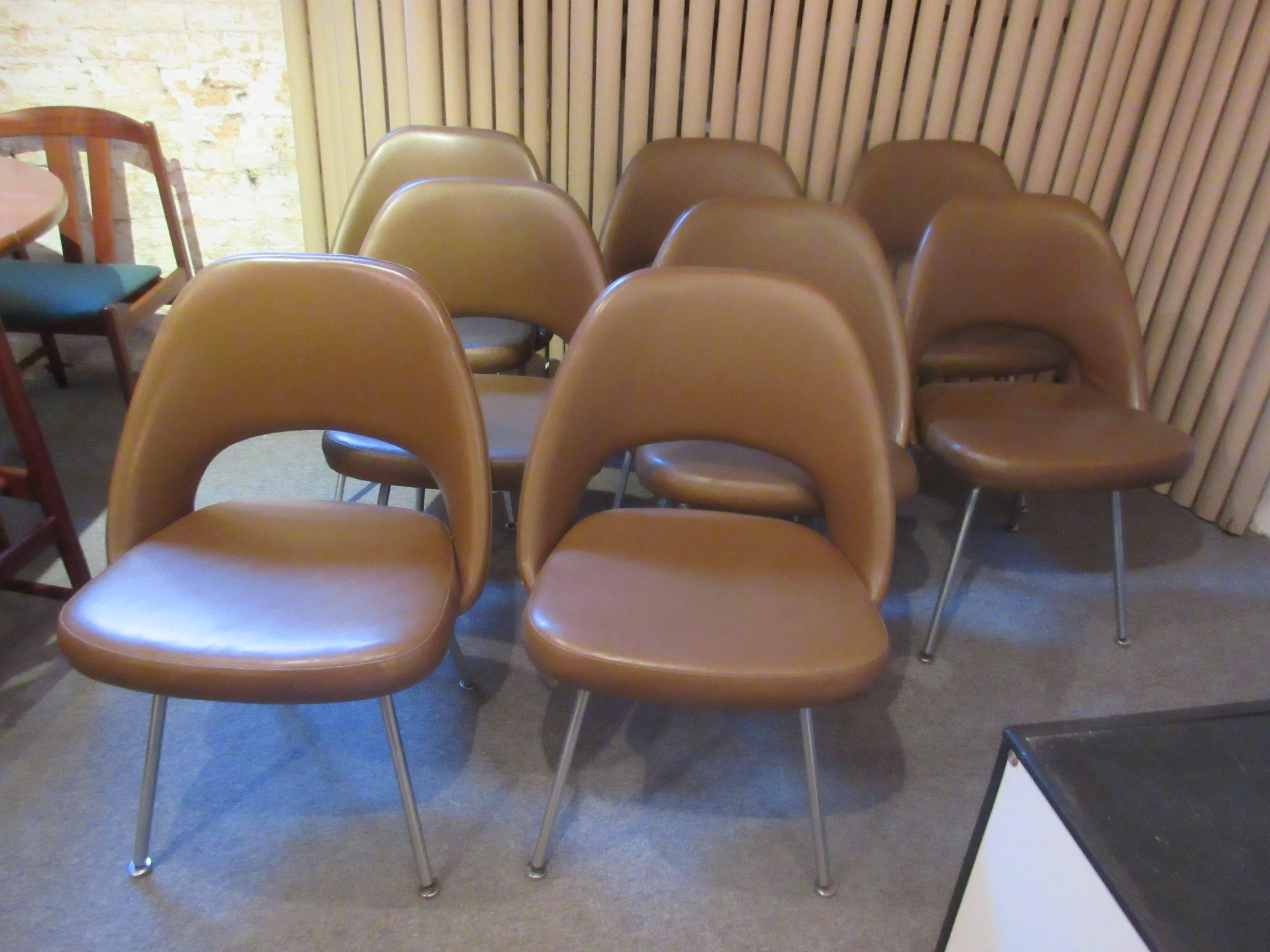 4 matching dining chairs in a greenish pond sludge brown vinyl. Some retain Knoll tags. All original.