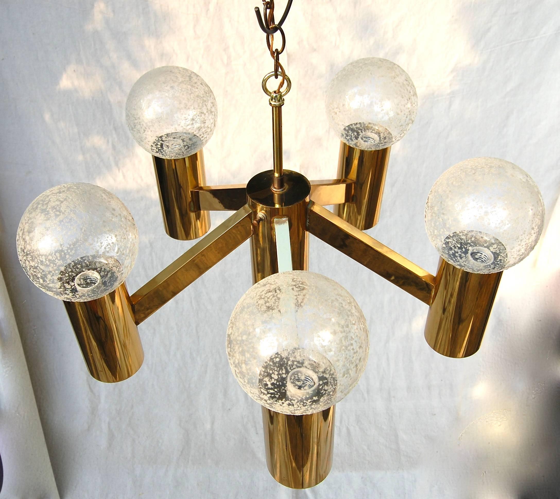Very nice brass chandelier with glass ball speckled shades. Lights at the bottom of each cone as well to direct light towards table. Switch located on one of the cones to turn downward light on or off. Probably Lightolier or Sonneman Lighting.