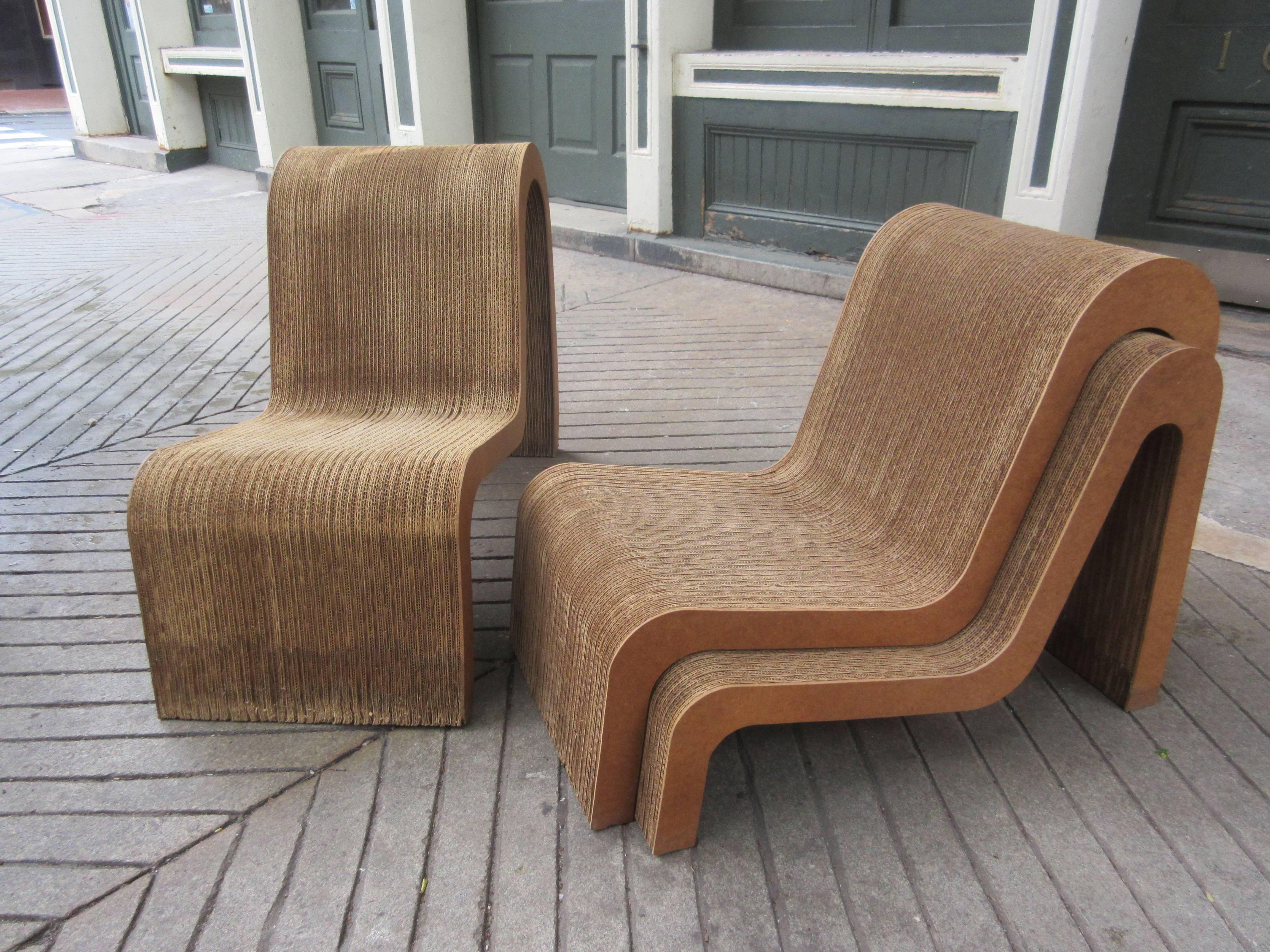 Seldom seen easy edges nesting chair set! Three individual chairs that stack neatly into one unit. Innovative use of materials were the hallmark of this early 1970s design from Architect Frank Gehry. Chairs show a little water damage towards