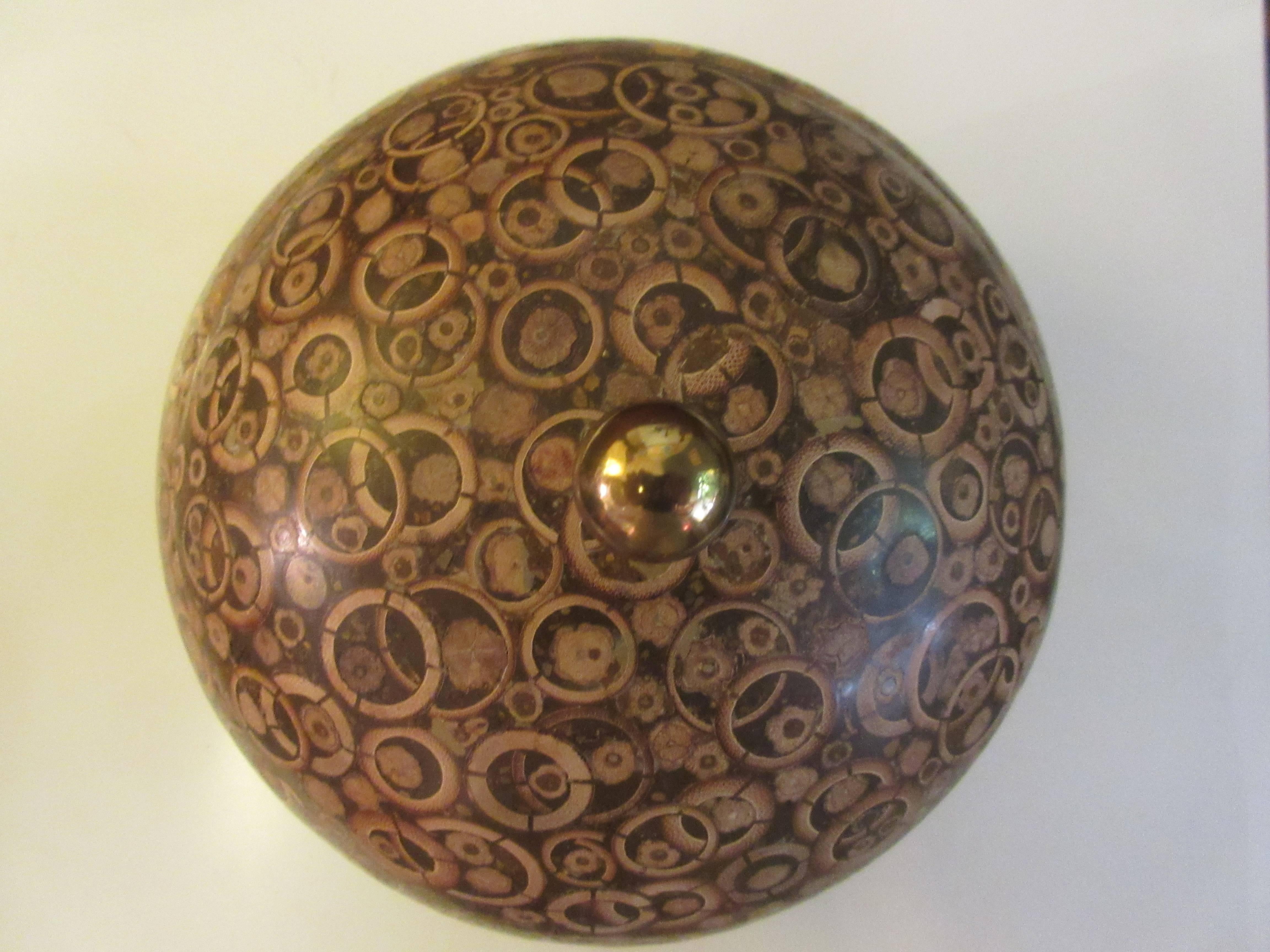 Sphere humidor covered in a thin veneer of sliced nuts giving a very unusual appearance. Retains original label.