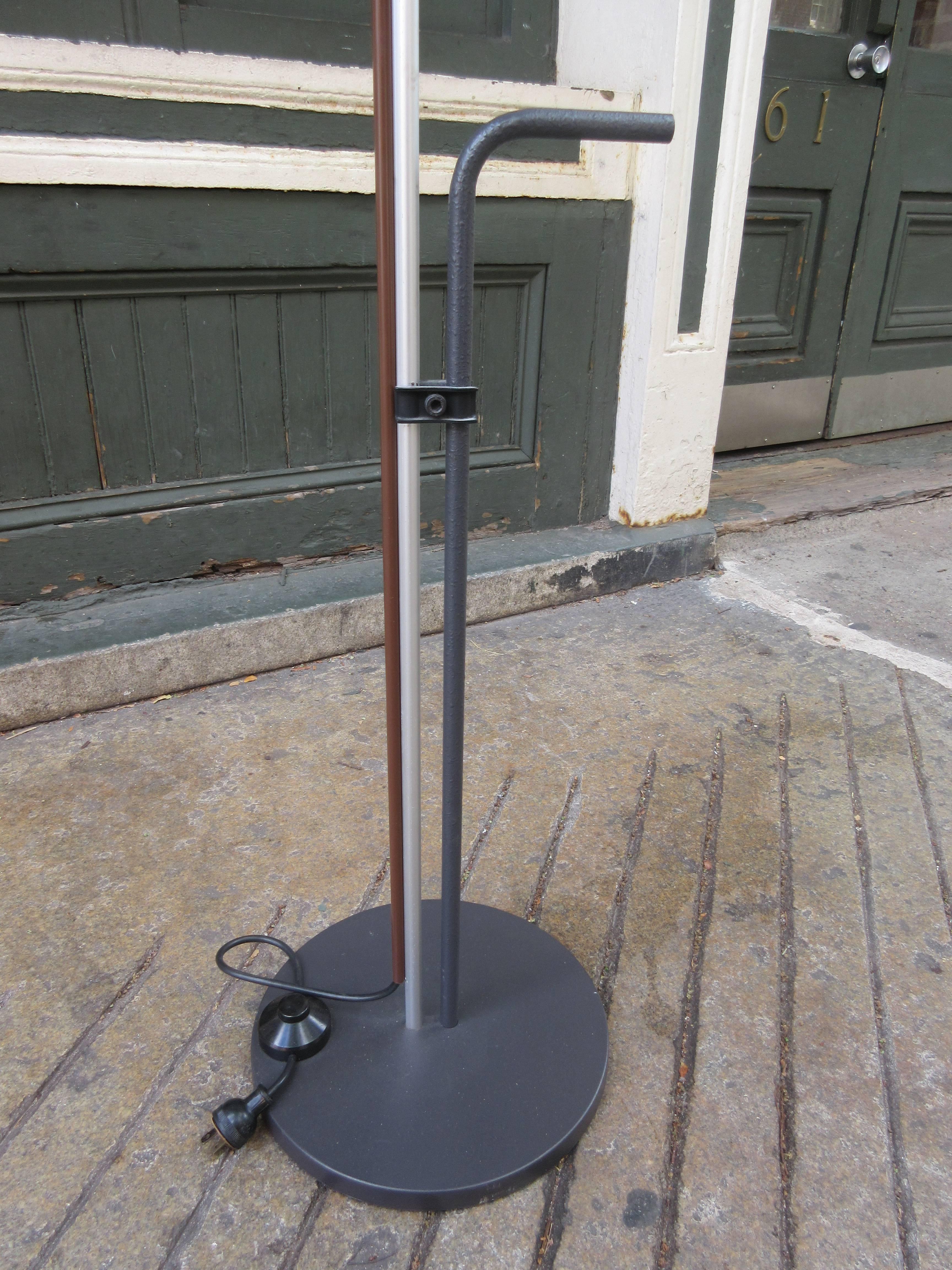 Adjustable floor lamp with gray plastic shade and umbrella handle for lifting. Retains label and is perfect.