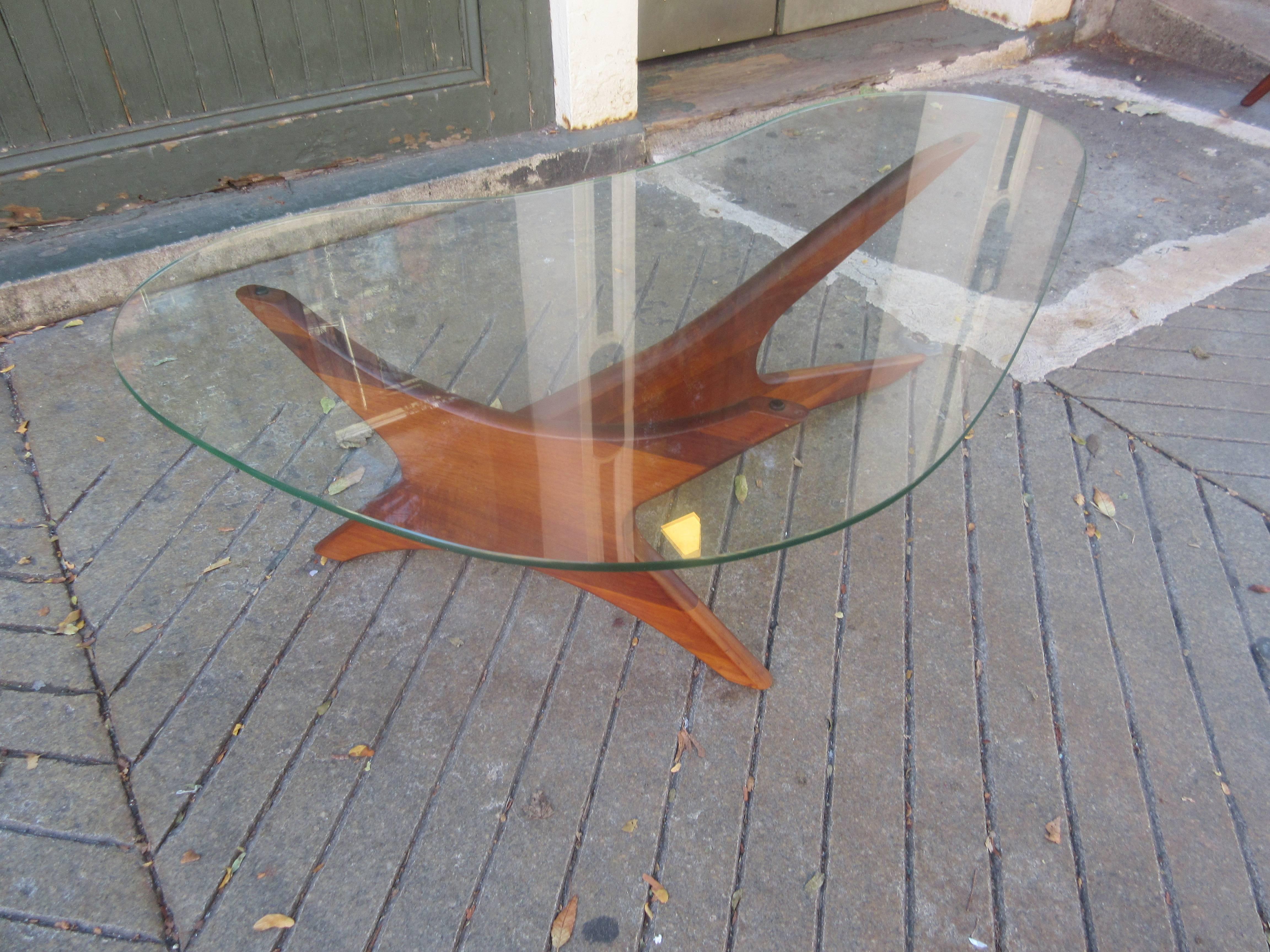 Sold walnut glass topped coffee table in the style of Adrian Pearsall.