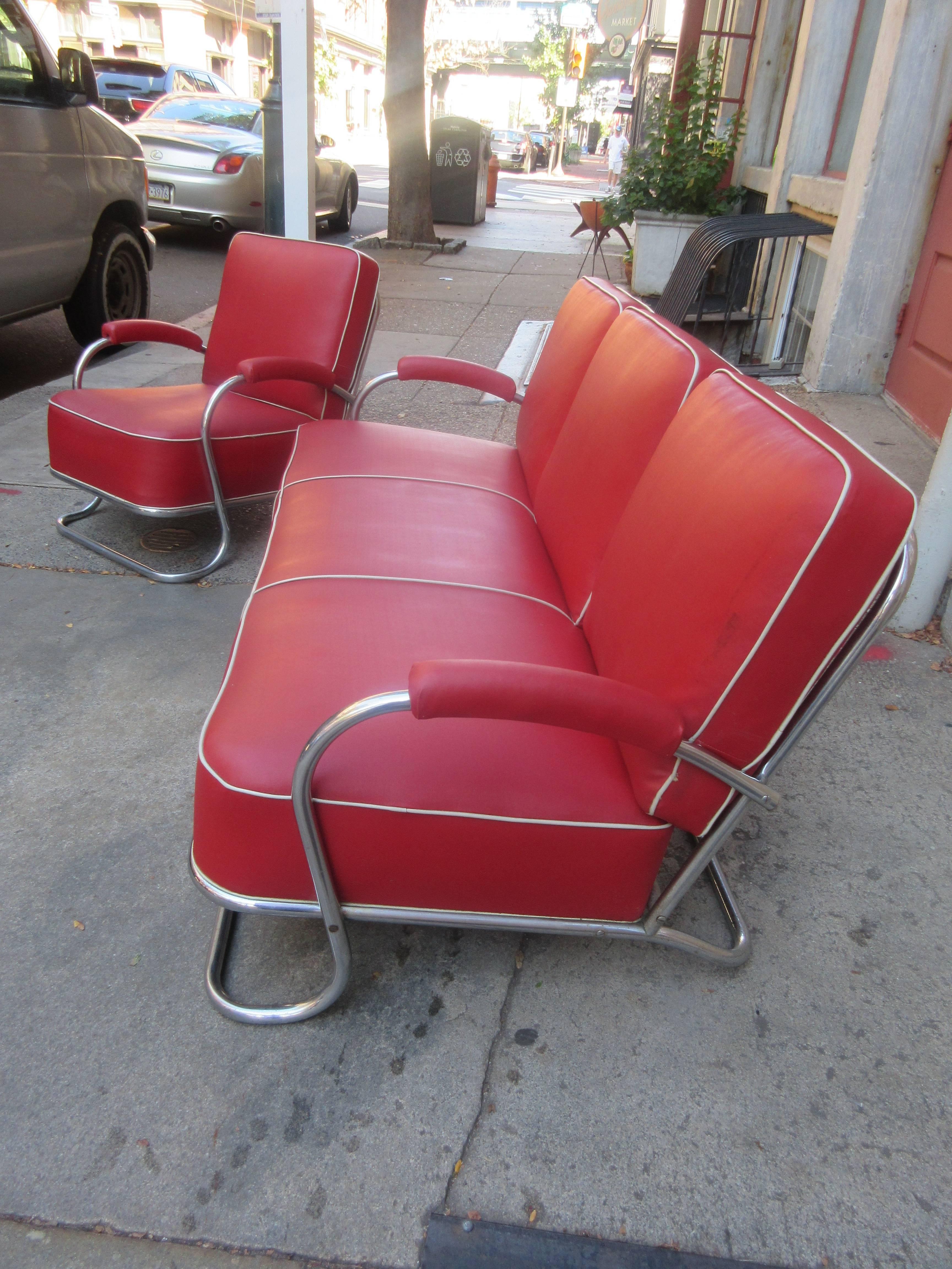 Nice set that was reupholstered maybe 15 years ago in red vinyl with white piping. Possibly manufactured by either Howell or Troy Sunshade in the late 1930s Chrome shows a little wear on front bar but overall presents very well! Nice thick fitted