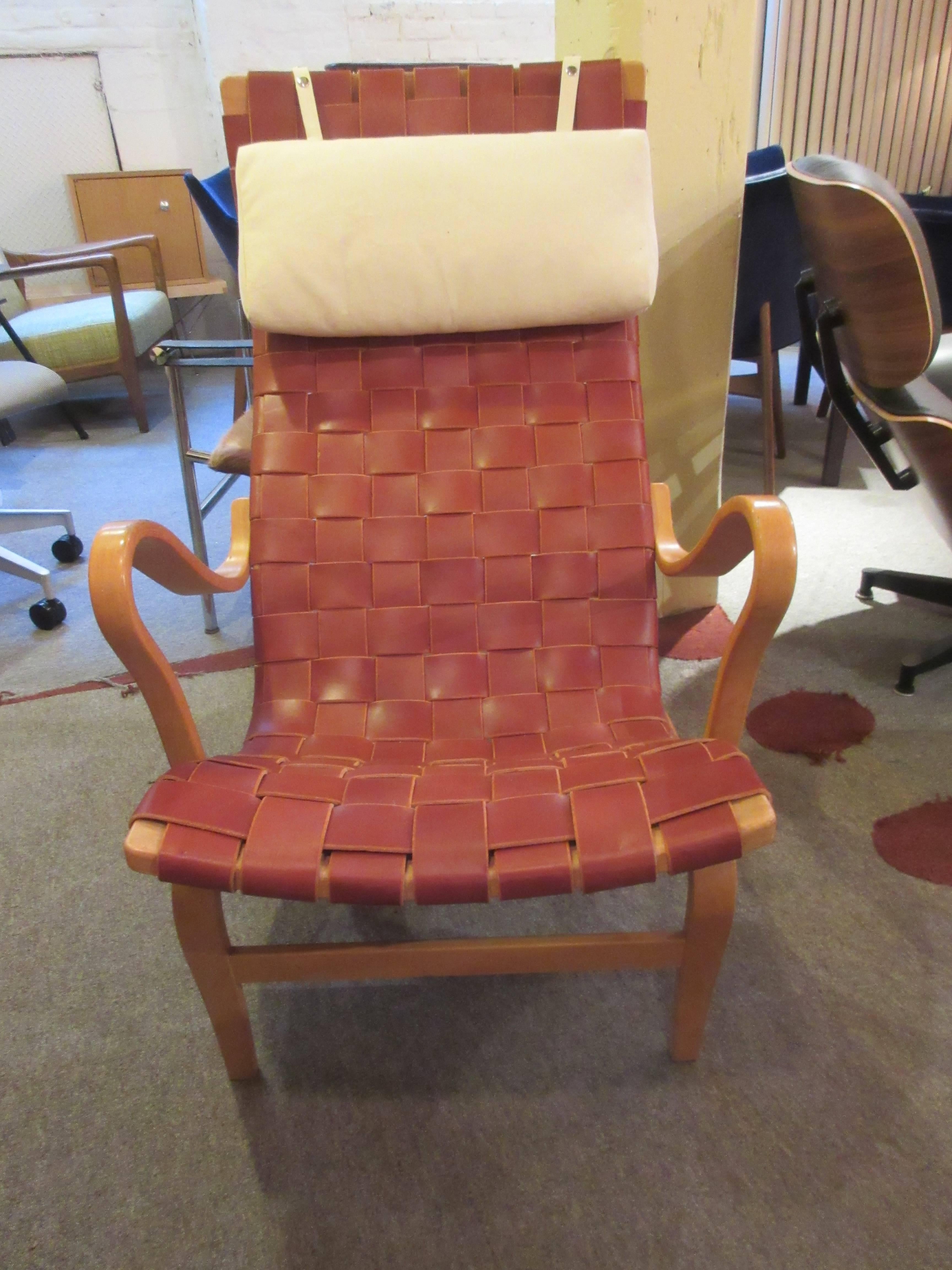 Large upright lounge chair restrapped in chestnut leather on bentwood frame with adjustable canvas head cushion. Originally designed in 1934 this is a 1960s version.