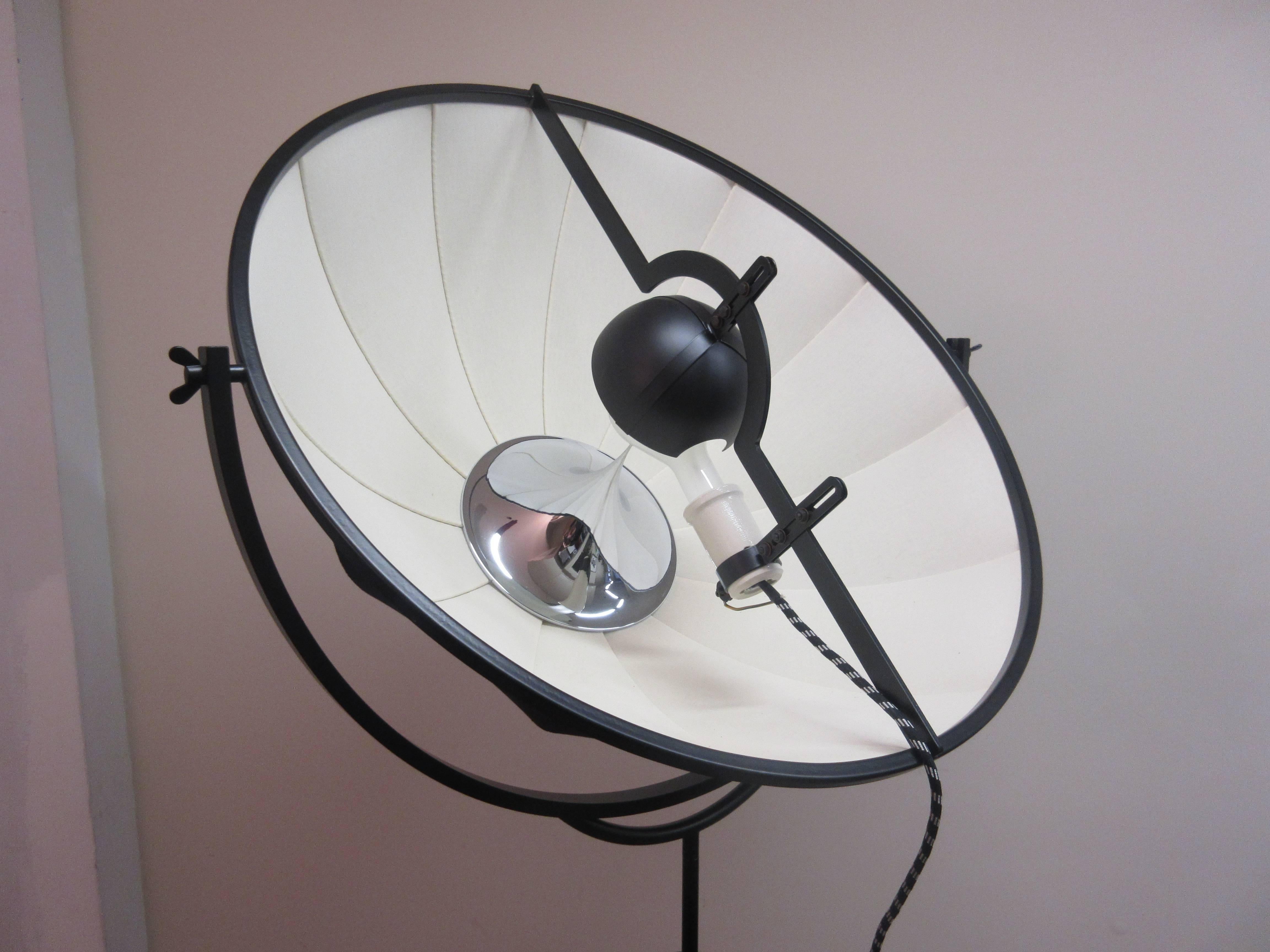 Fortuny lamp still in original Pallucco packaging never used. A 500 watt bulbs give you all the lumens you could need. Designed in 1985 in a black powder coated finish. All original printed material is included. Tripod base allows for adjustable