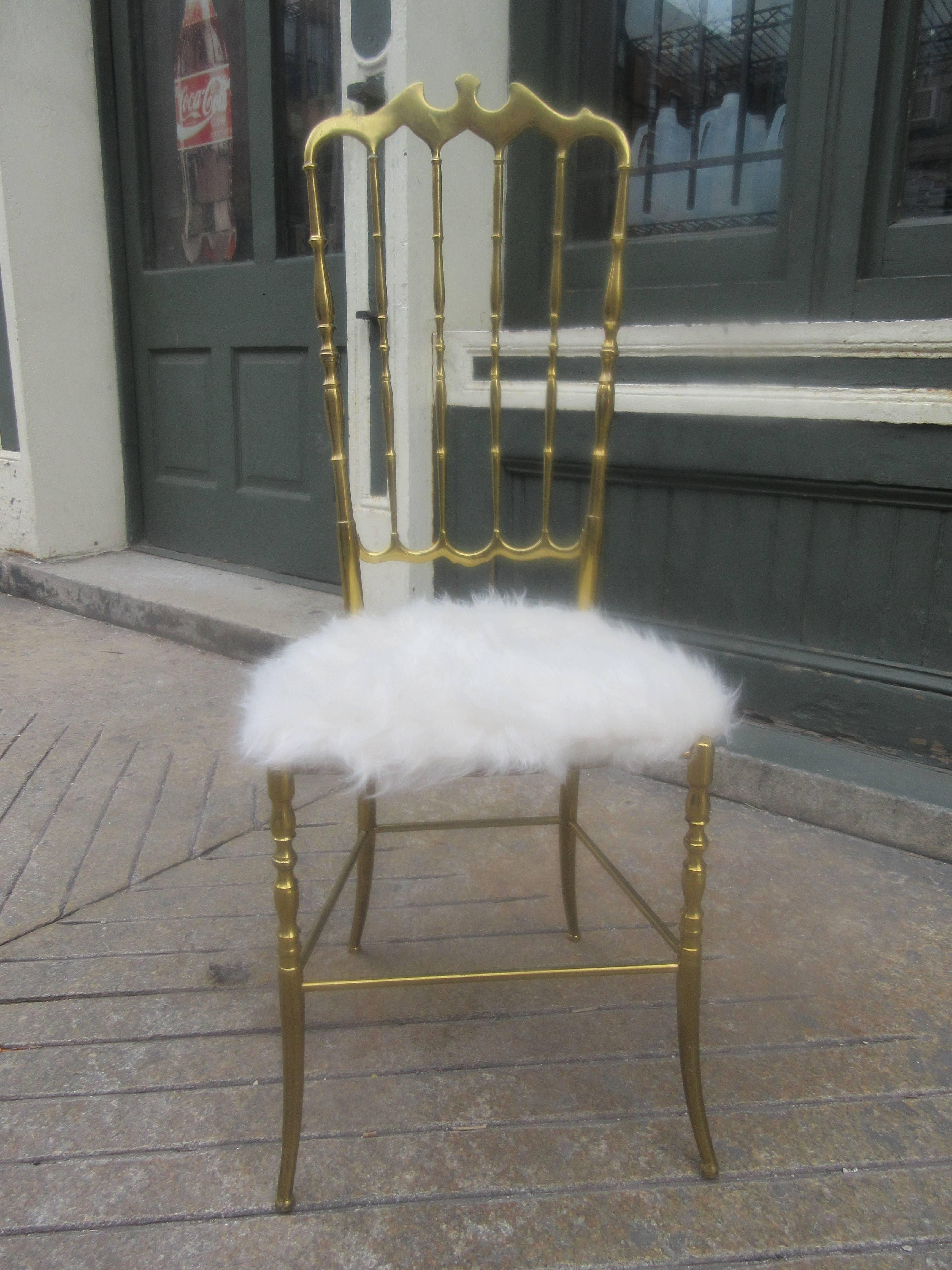 The Italian company Chiavaro made this chair in solid brass. We have upholstered it in an acrylic fur making it a perfect boudoir chair. This chair is the high backed version.