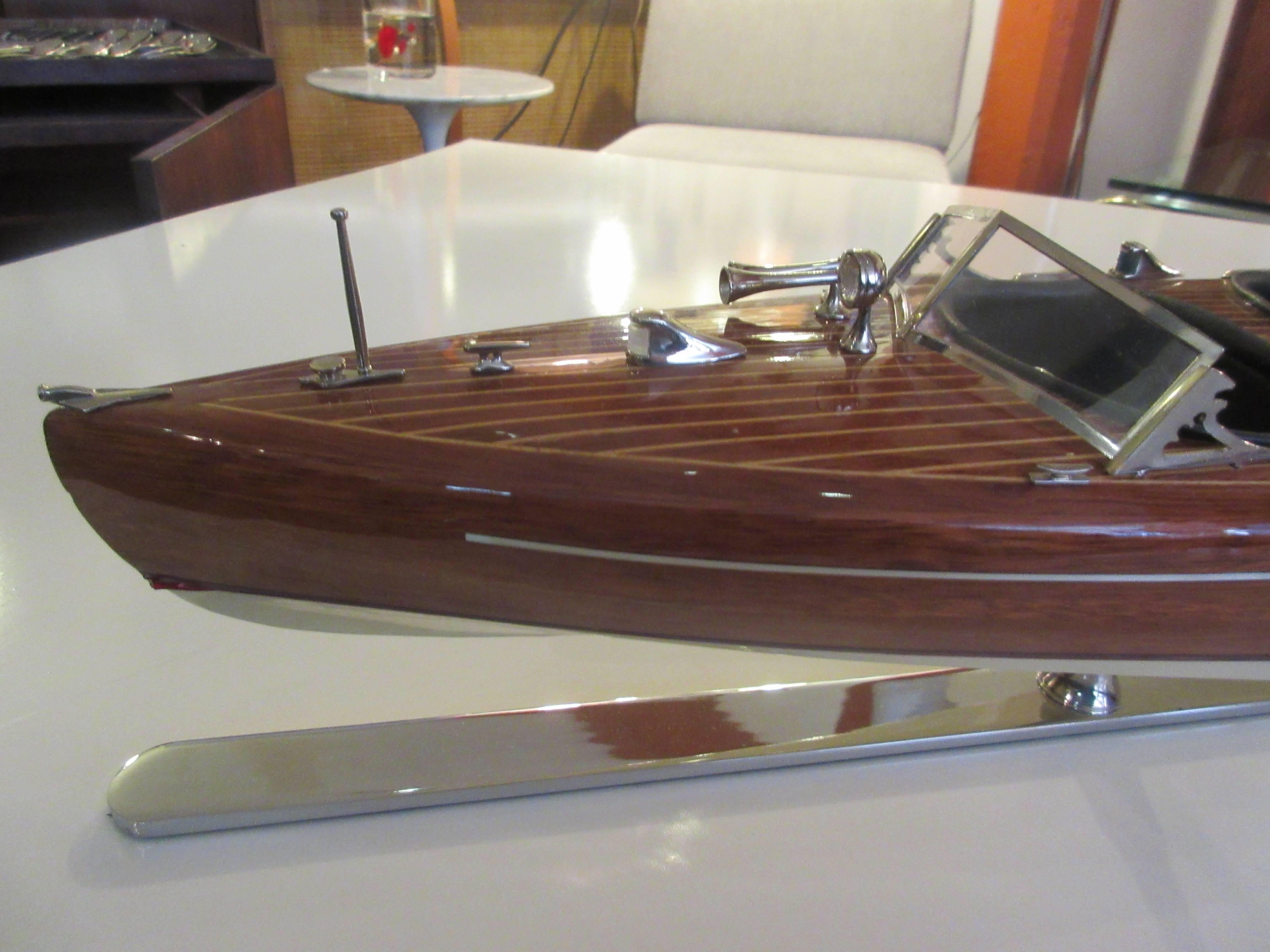 Chris-craft scale model mahogany inboard motor runabout on chrome stand. Impress friends, family. Co-workers and clients with this scale model of your boat! Perfect in every way and detailed to the last. In original packaging.