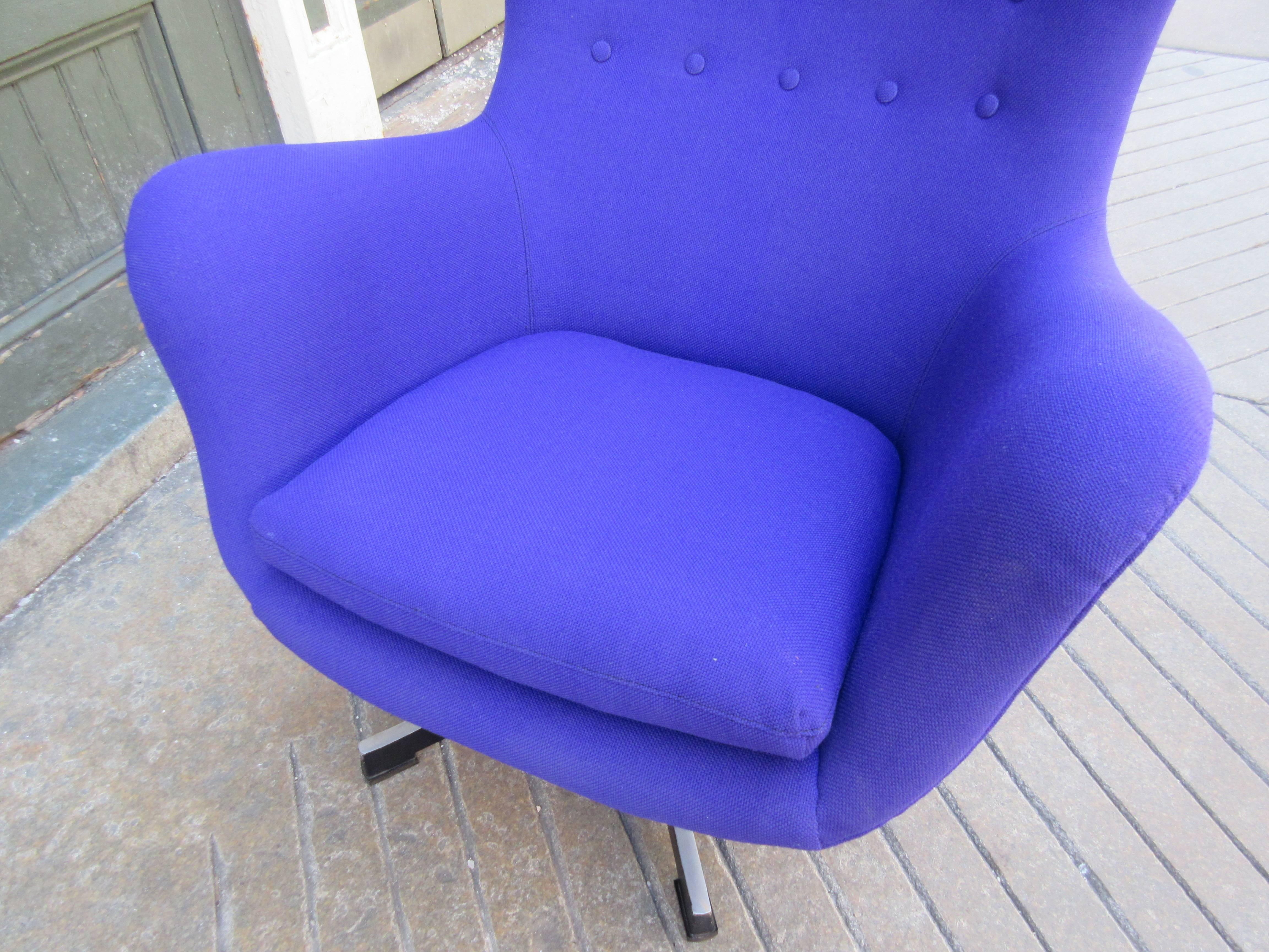 In the style of Arne Jacobsen's classic egg chair! Bought from the original owners who self-imported in the late 1960s. Newly upholstered in a bright purple hopsack. Aluminium base with painted black sides and four rubber glides. Two rows of buttons