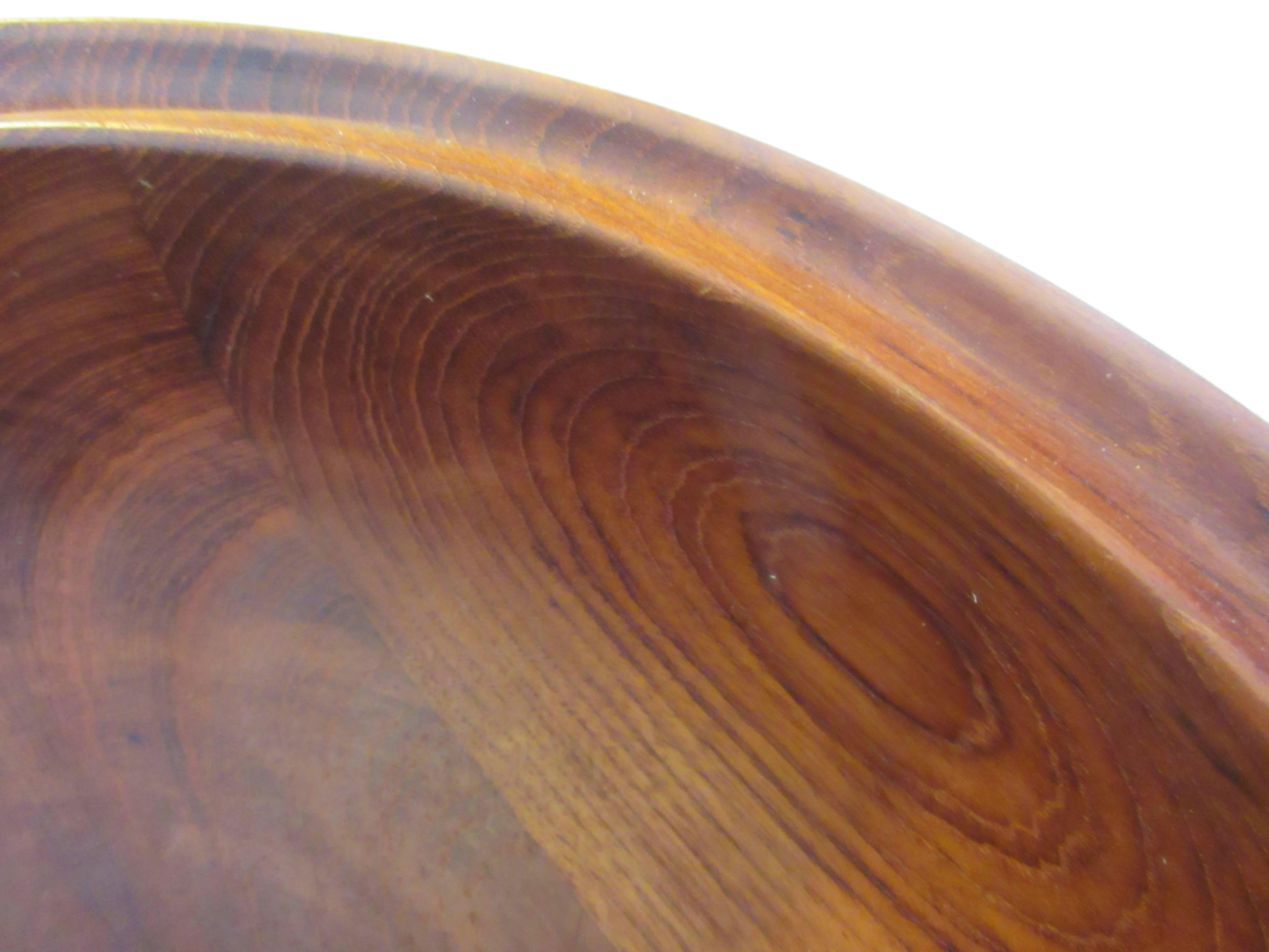 Henning Koppel for Georg Jensen salad bowl in teak with servers. Bought from original owner who lovingly used it for 50 years. Beautiful original condition with no stains or water marks.