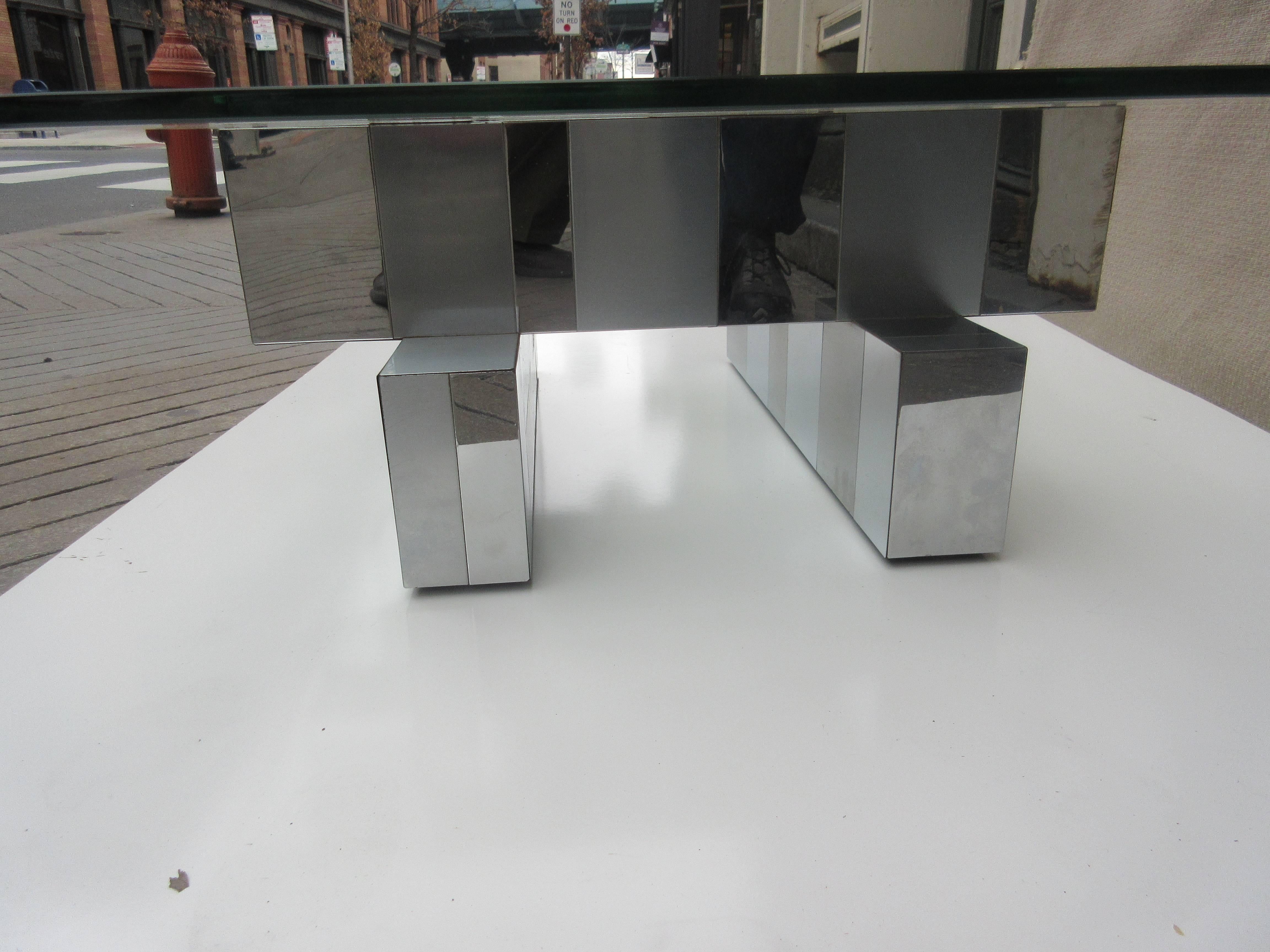 Paul Evans for Cityscape coffee table by Directional. Composed of rectangles of brushed and polish stainless steel covering beams laid out "Jenga" style supporting a 3/4 inch thick glass top. One plate signed with Paul Evans signature