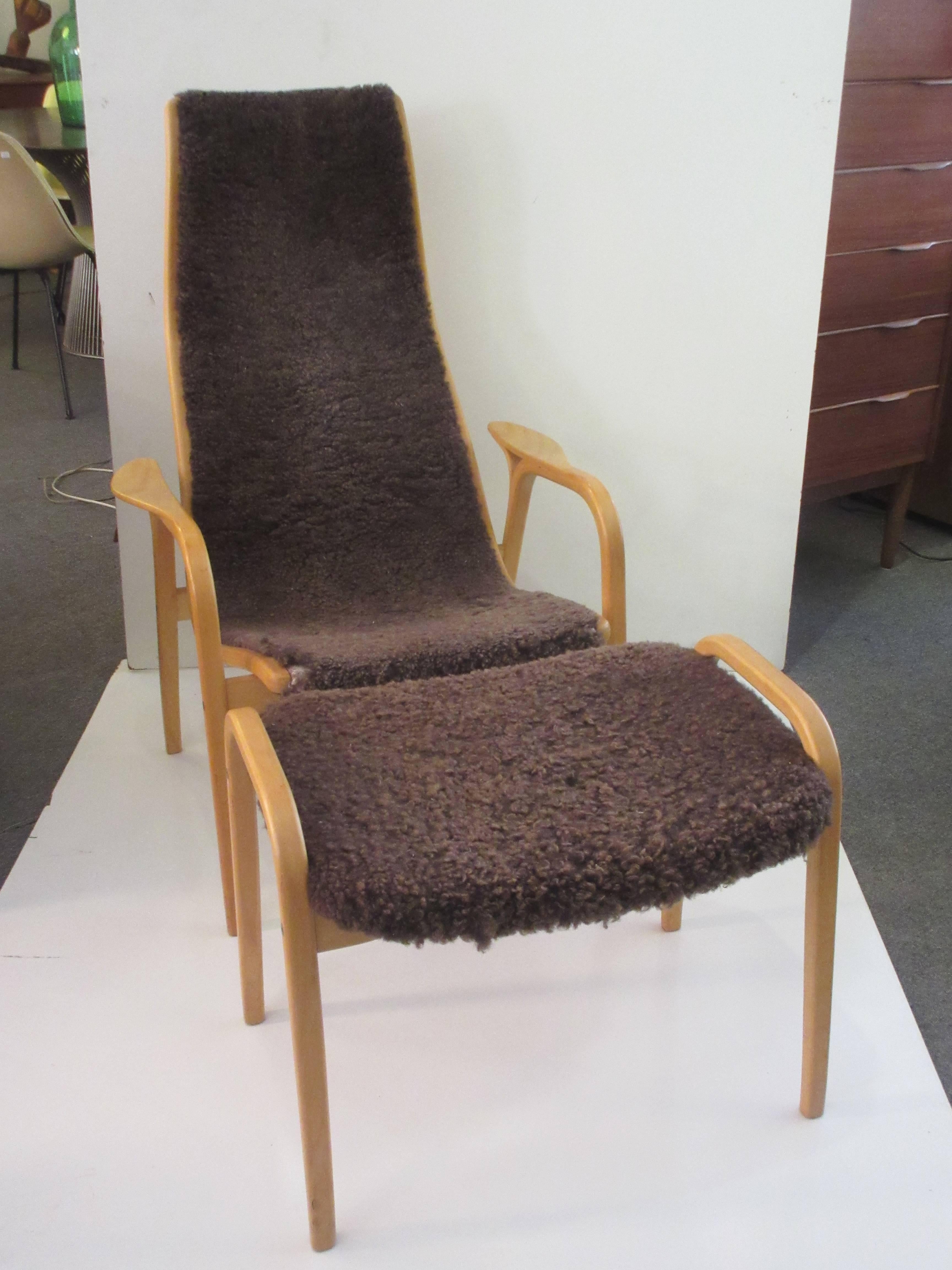 Yngve Ekstrom Lamino chair and ottoman by Swedese in brown sheep skin covering. Frames is of bent birch and both chair and ottoman have a branded label. This chair is completely original and in excellent condition. Lambs skin is just slightly worn