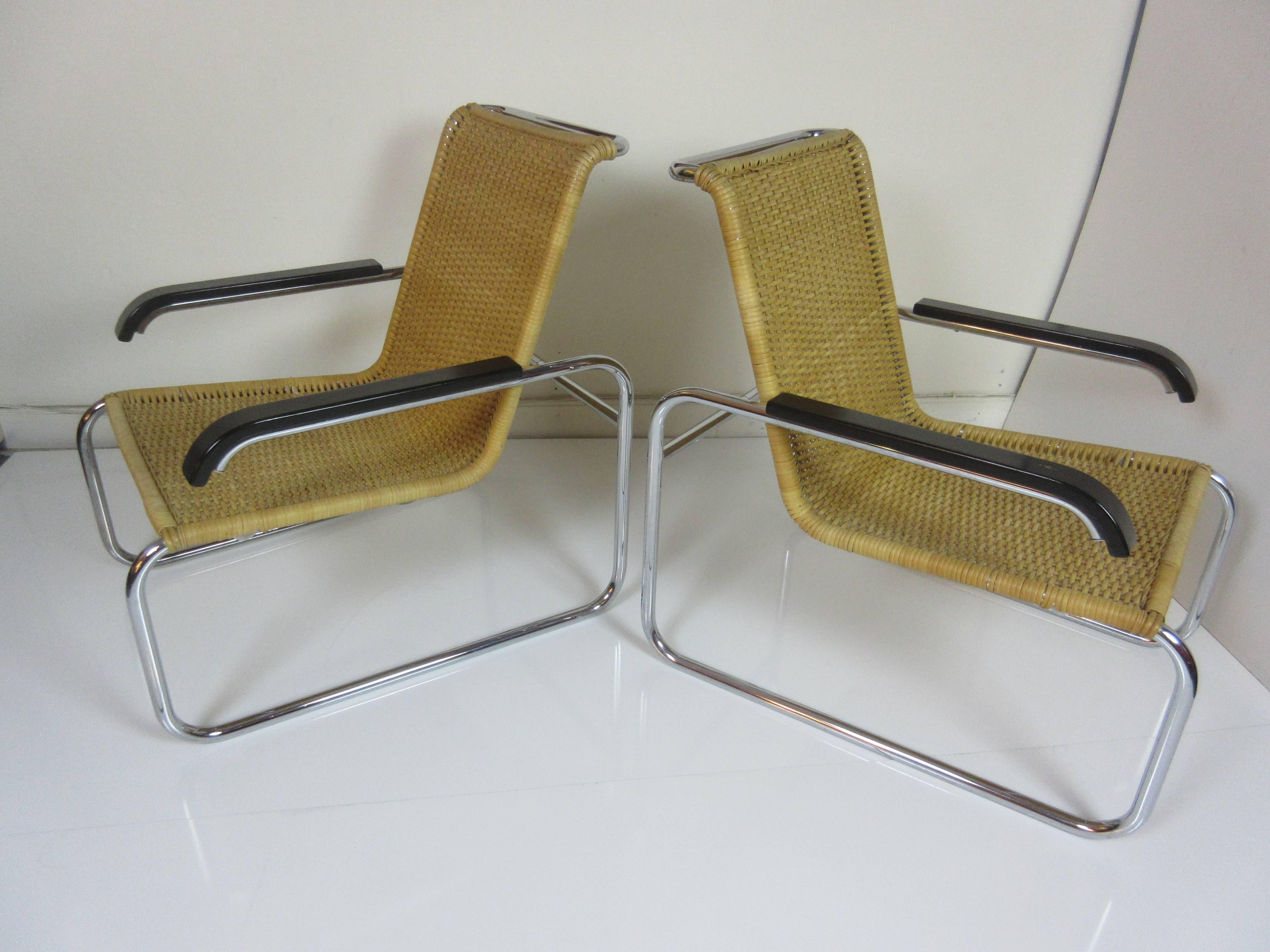 Marcel Breuer B 35 Chairs for Thonet. Designed in 1928 this pair is from the 1980s. The chrome and wicker is in exceptional condition. The black painted arms show very minimal wear in the edges. The cantilevered design allow a gentle spring motion