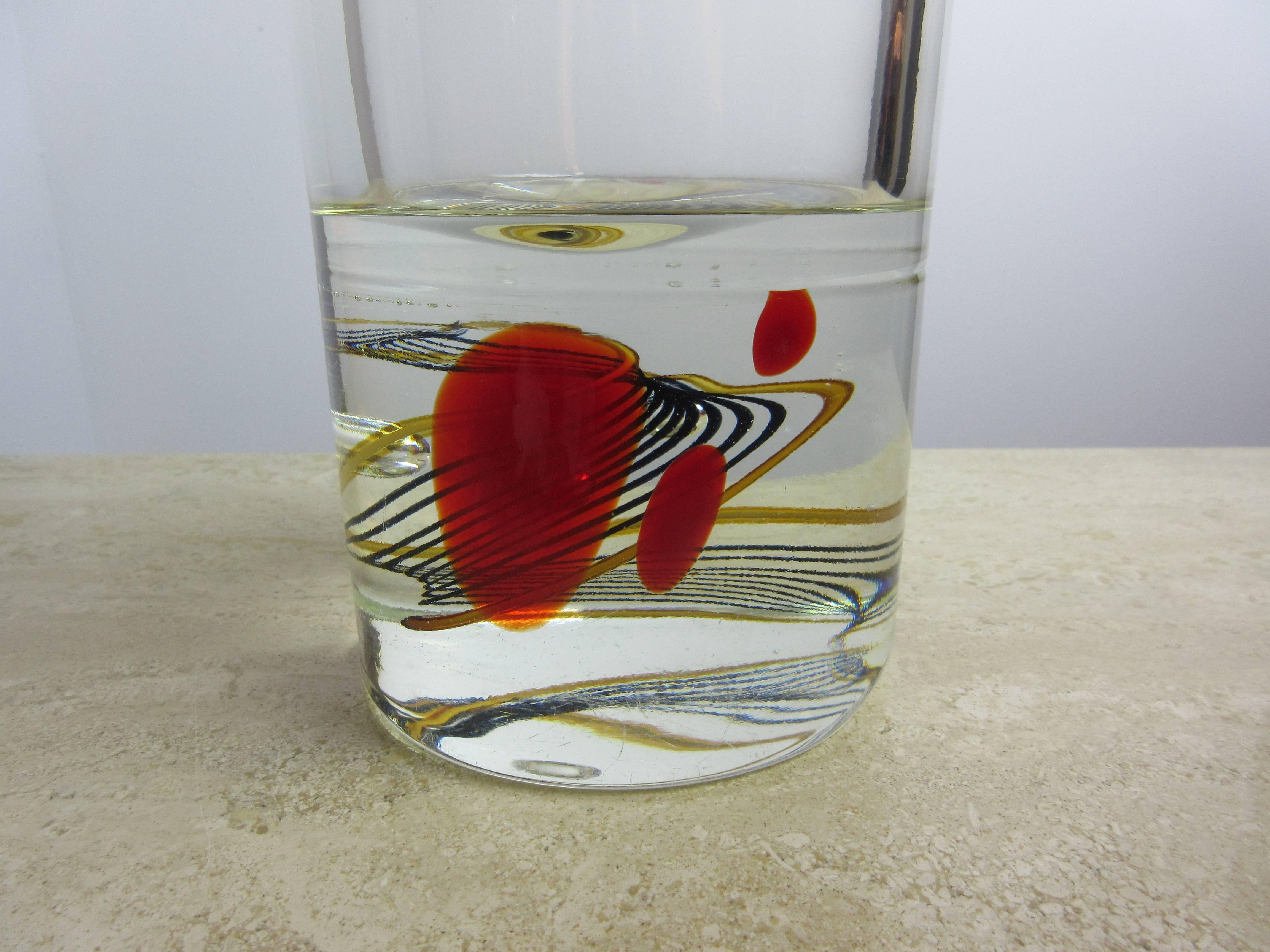 Signed signature etched bottom. Very heavy, blown glass with nice polished edge and bottom. Solid 4" bottom with black and gold swirls and off to one side three red dots! Beautiful simple form!