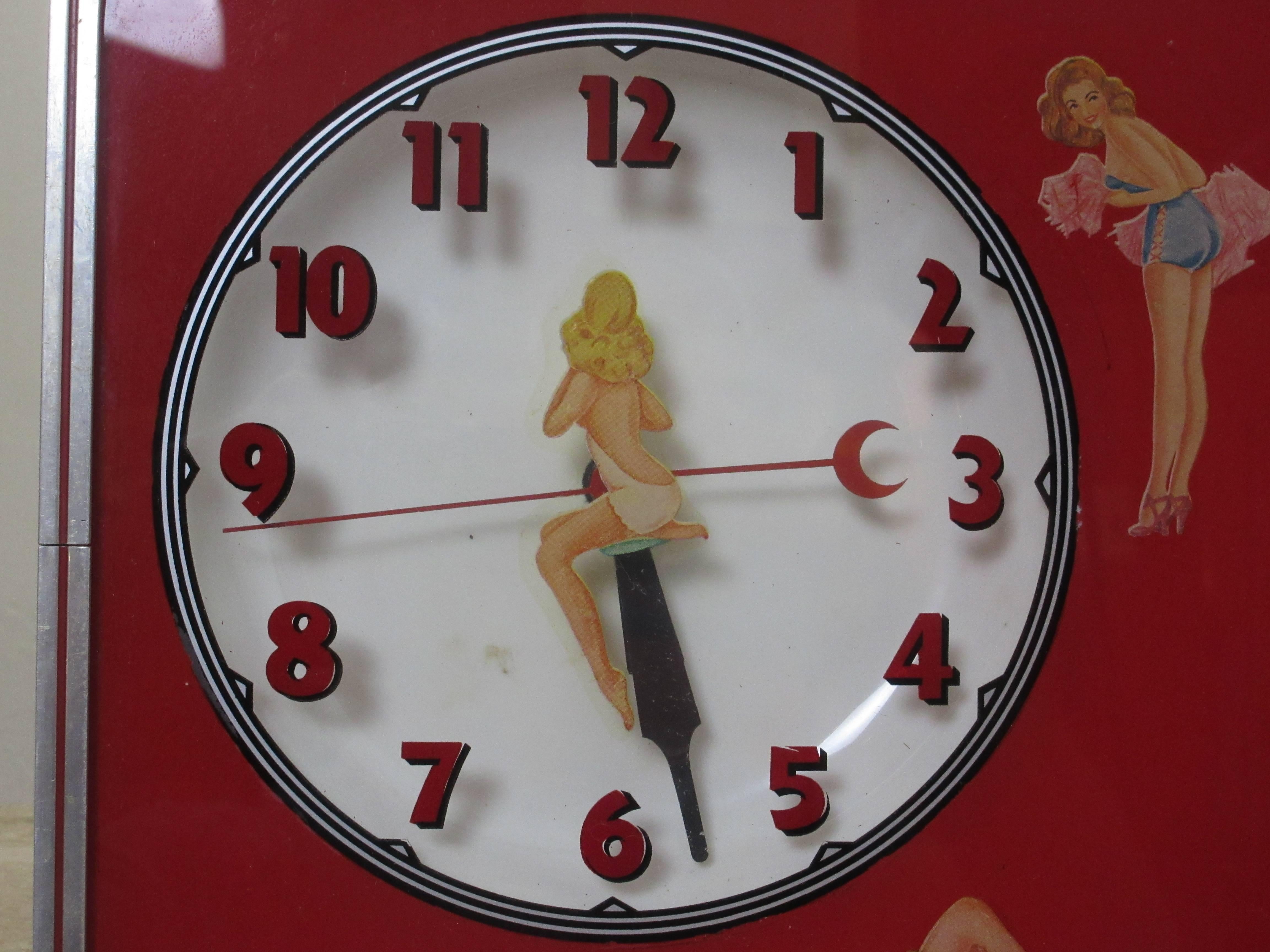 Pin-Up girl fans, here is a unique working lighted clock! Pin-up decals attached to red glass, one pin up in the middle of the clock face. Very unique piece, all original right down to its original decal manufacturing label!