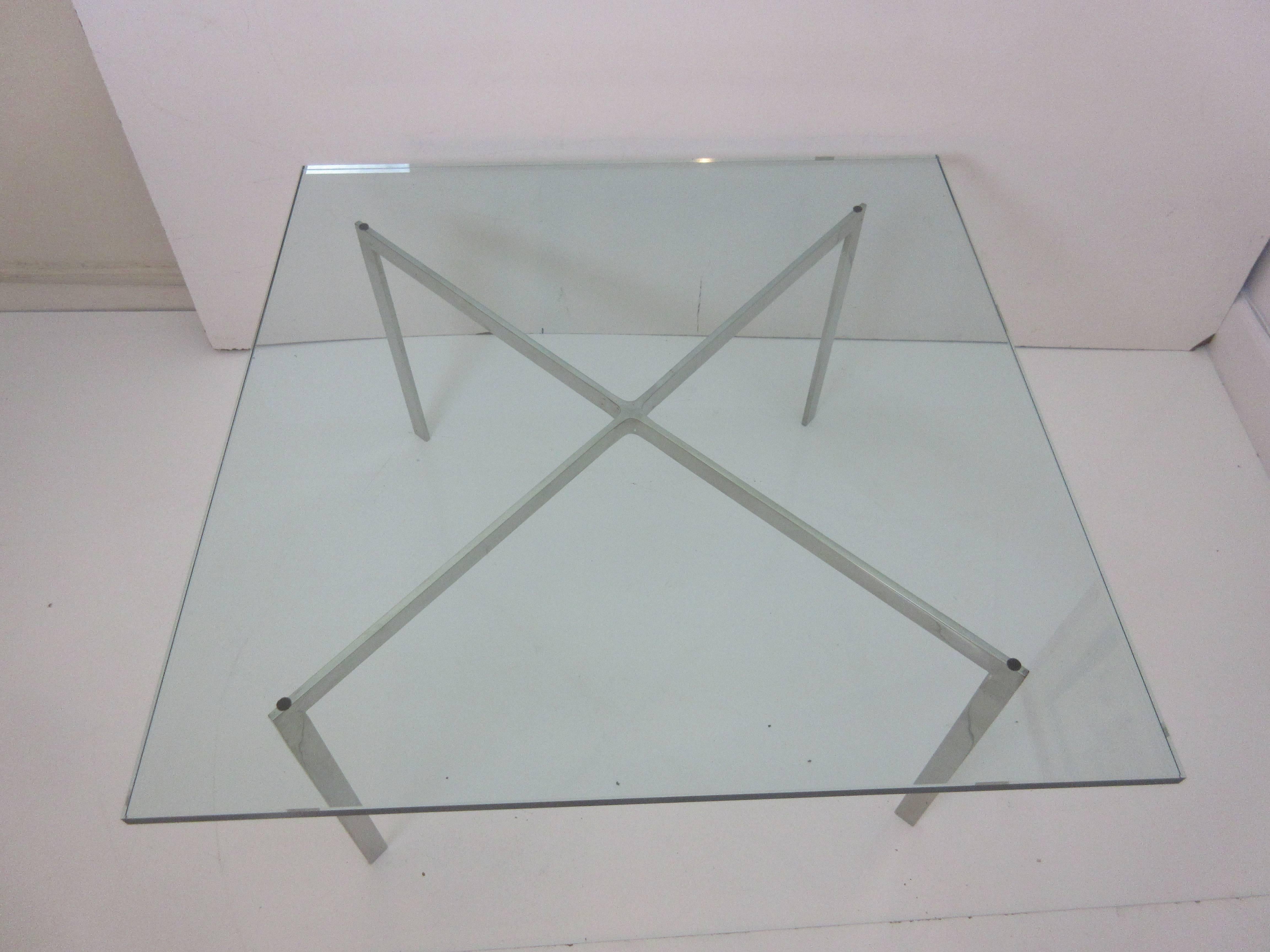 Barcelona style coffee table in the manner of Mies van der Rohe Italian production. Show some age probably 1970s. Slight higher and smaller dimensions than the real thing 36 square x 18.5 high and the glass is 5/8 thick. Stainless base.