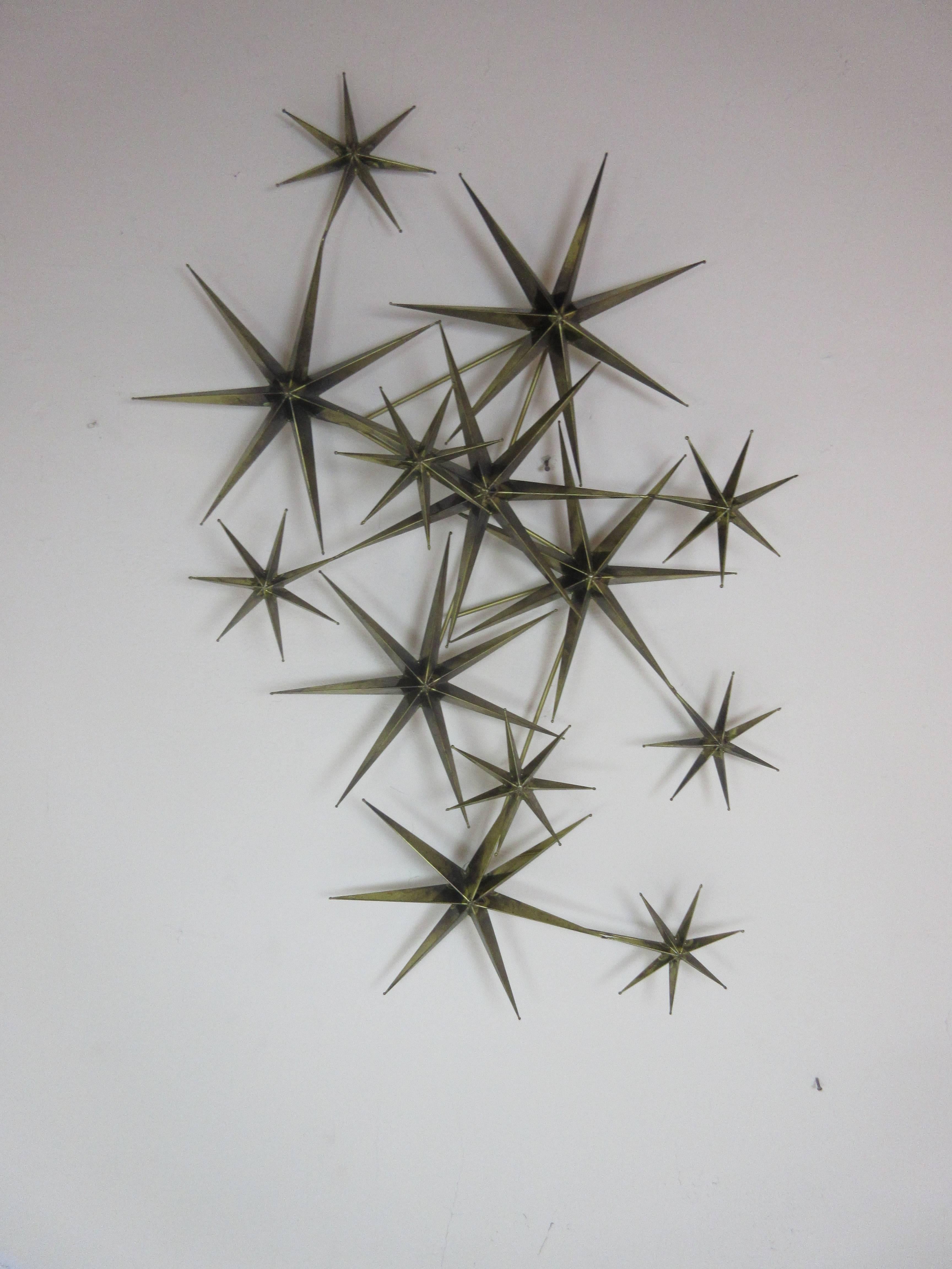 C. Jere star wall sculpture in burnished brass. Jere sculpture that can be hung in many different positions and has a wonderful three dimensional aspect to it.