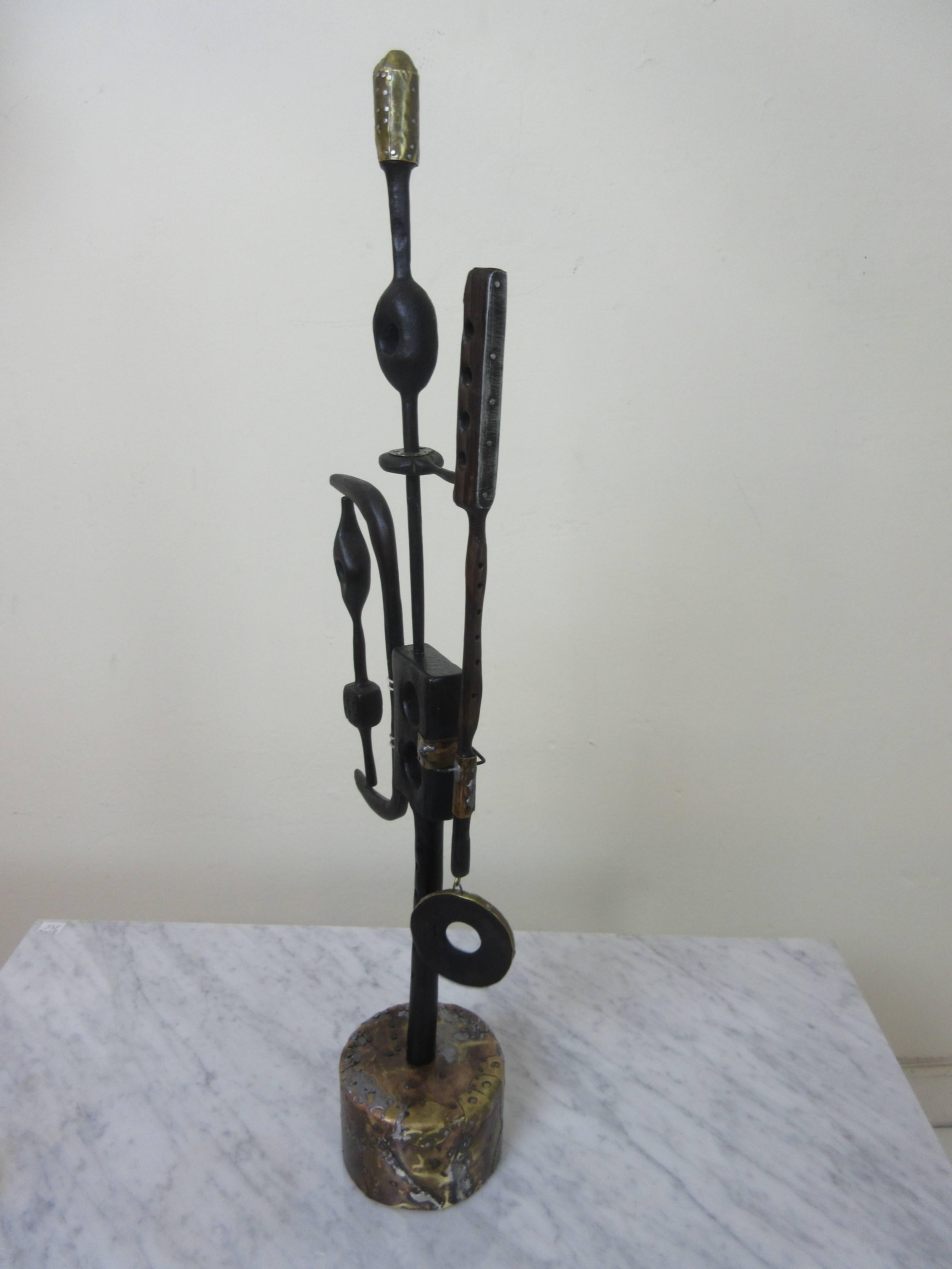 Adam Henderson sculpture limelight, 2016. Adam's Limelight channels a Tribal Primitivism vibe and is made of wood and nailed sheet metal with a bronzed patina. Commissions are welcome is you have size, color and material requirements.
