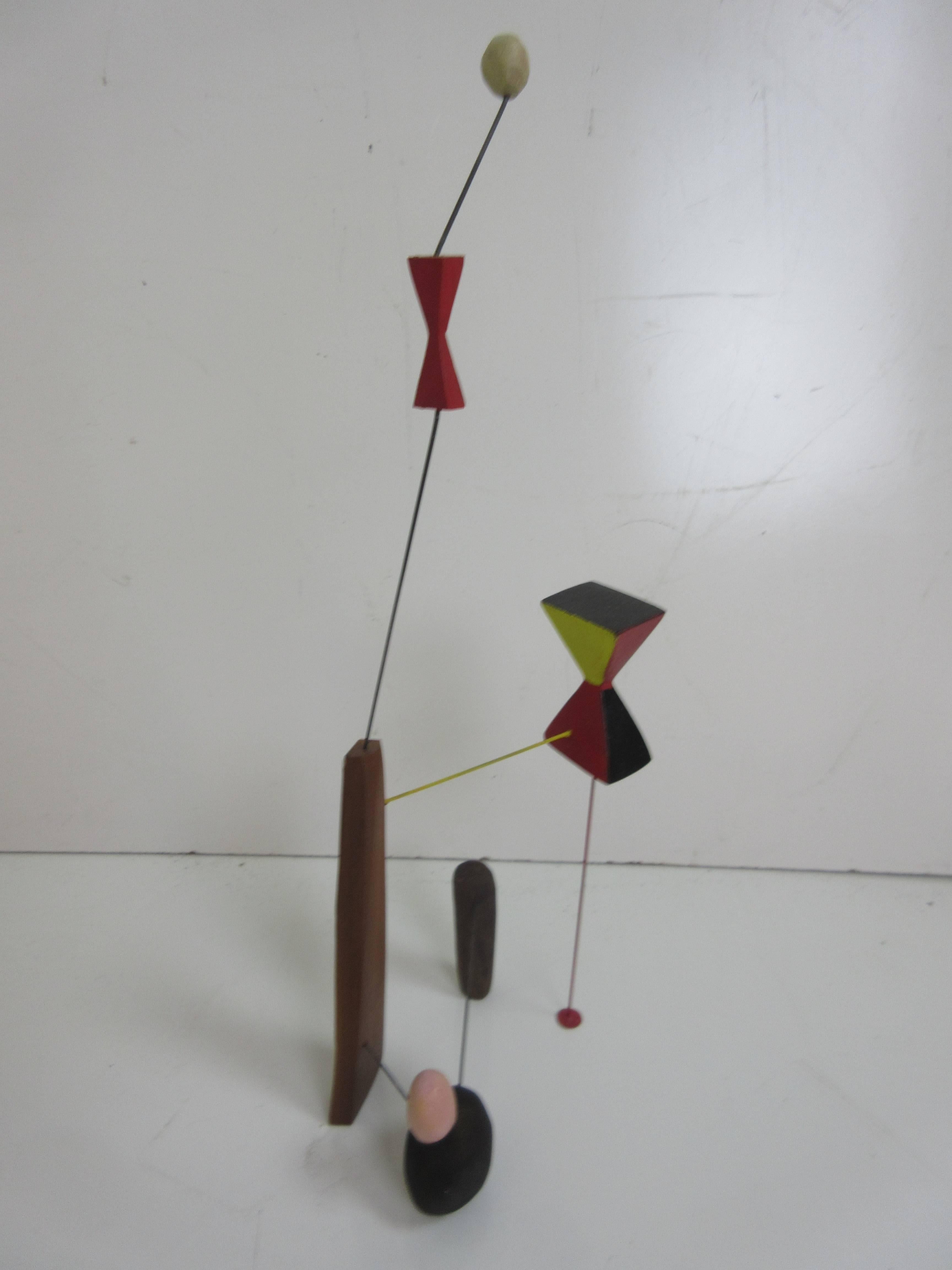 Adam Henderson sculpture constellation of wire, wood and paint. A playful juxtaposition of shapes and colors.