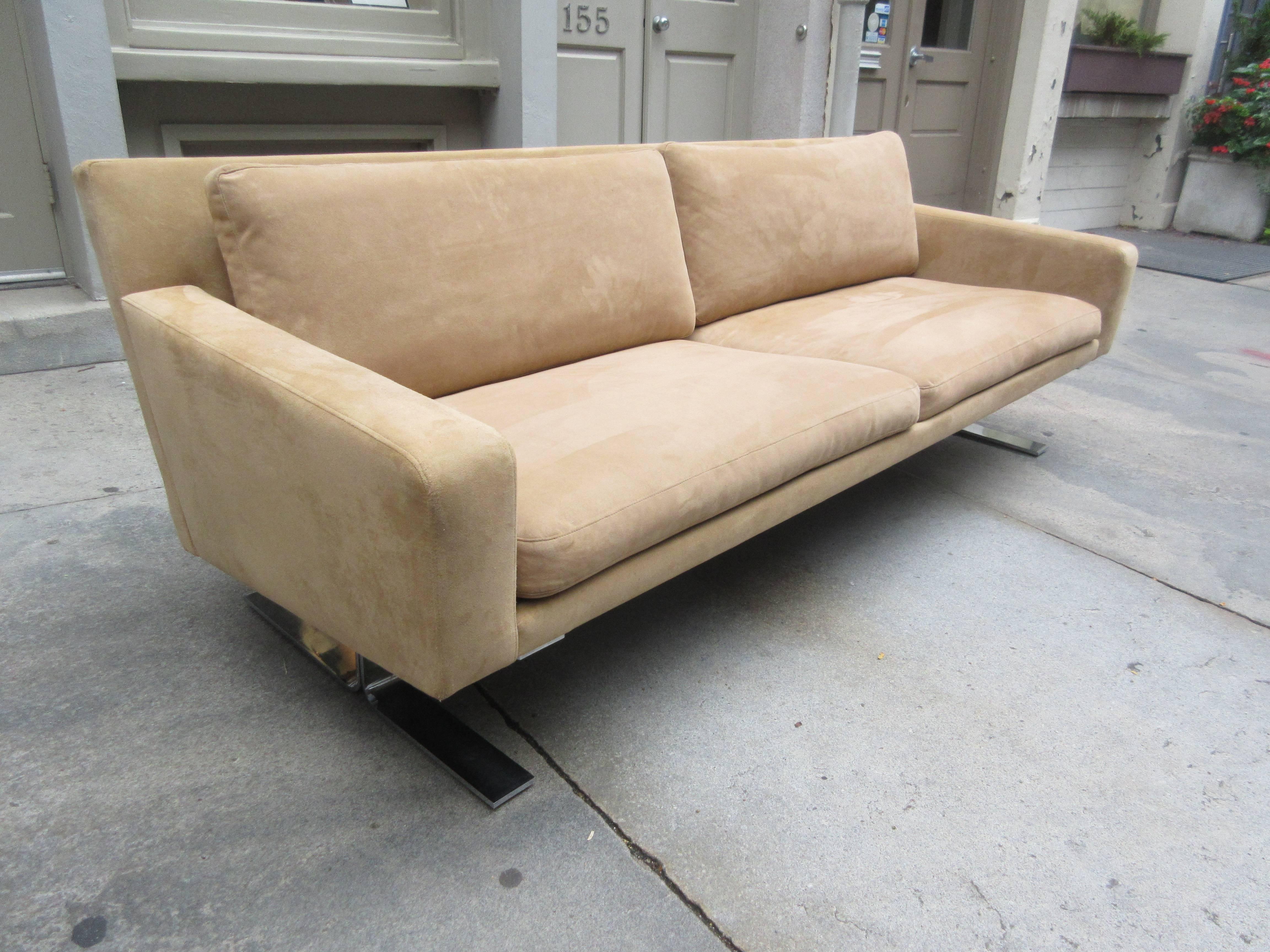 Nice scale Danish sofa by Erik Ole Jorgensen for DUX Furniture. Two large flat-band Chromed Metal Sled type Feet suspend this low slung sofa. Covered 15 years ago in a tan ultrasuede fabric. Still presents very well but fabric is not perfect. One