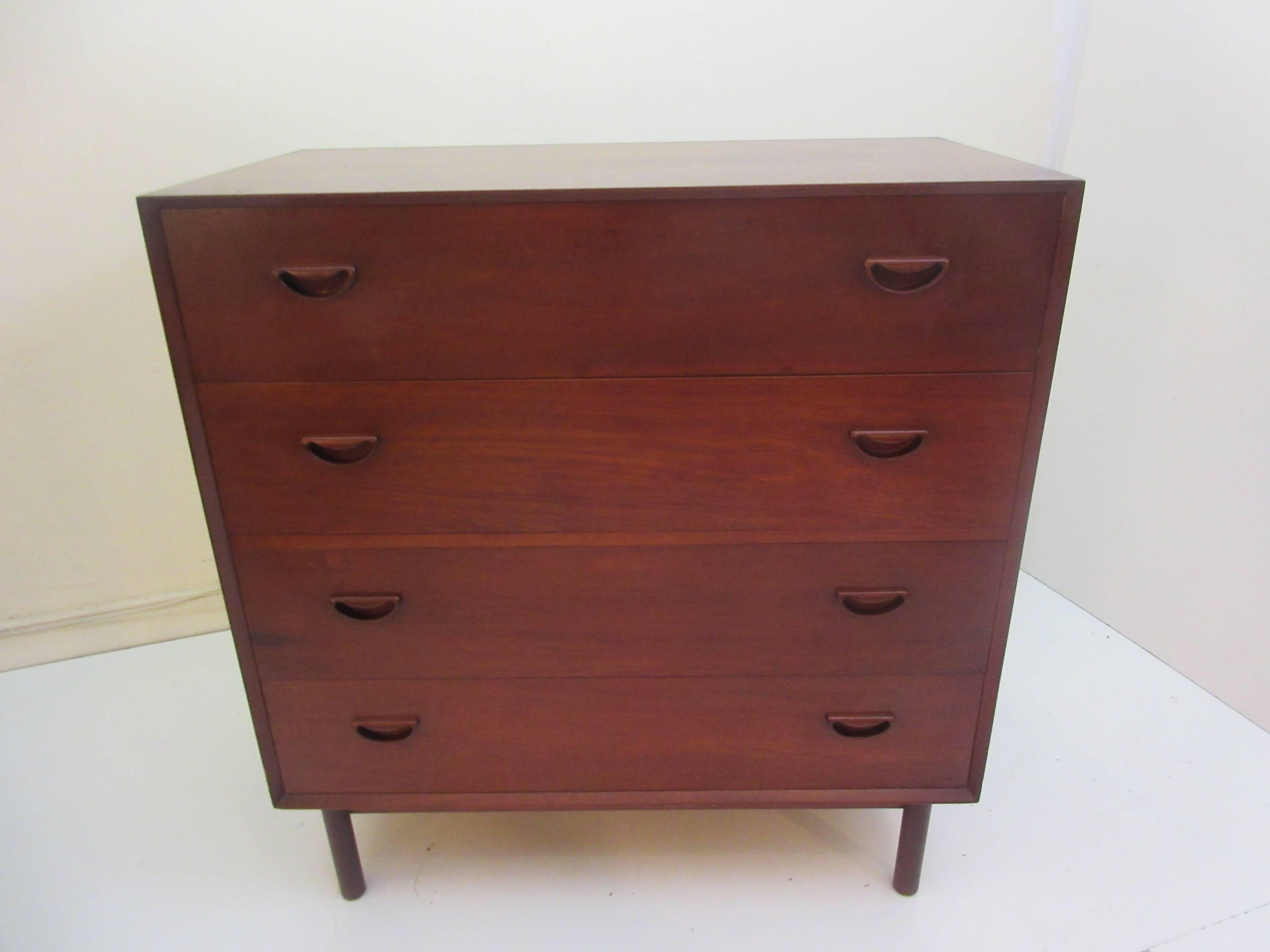 Peter Hvidt for John Stuart solid teak drop front desk or vanity with three storage drawers. Model number 307C in the John Stuart, 1957 catalogue (pictured). This piece has the unique to Hdivt tenon joinery on the corners of the cabinet top and