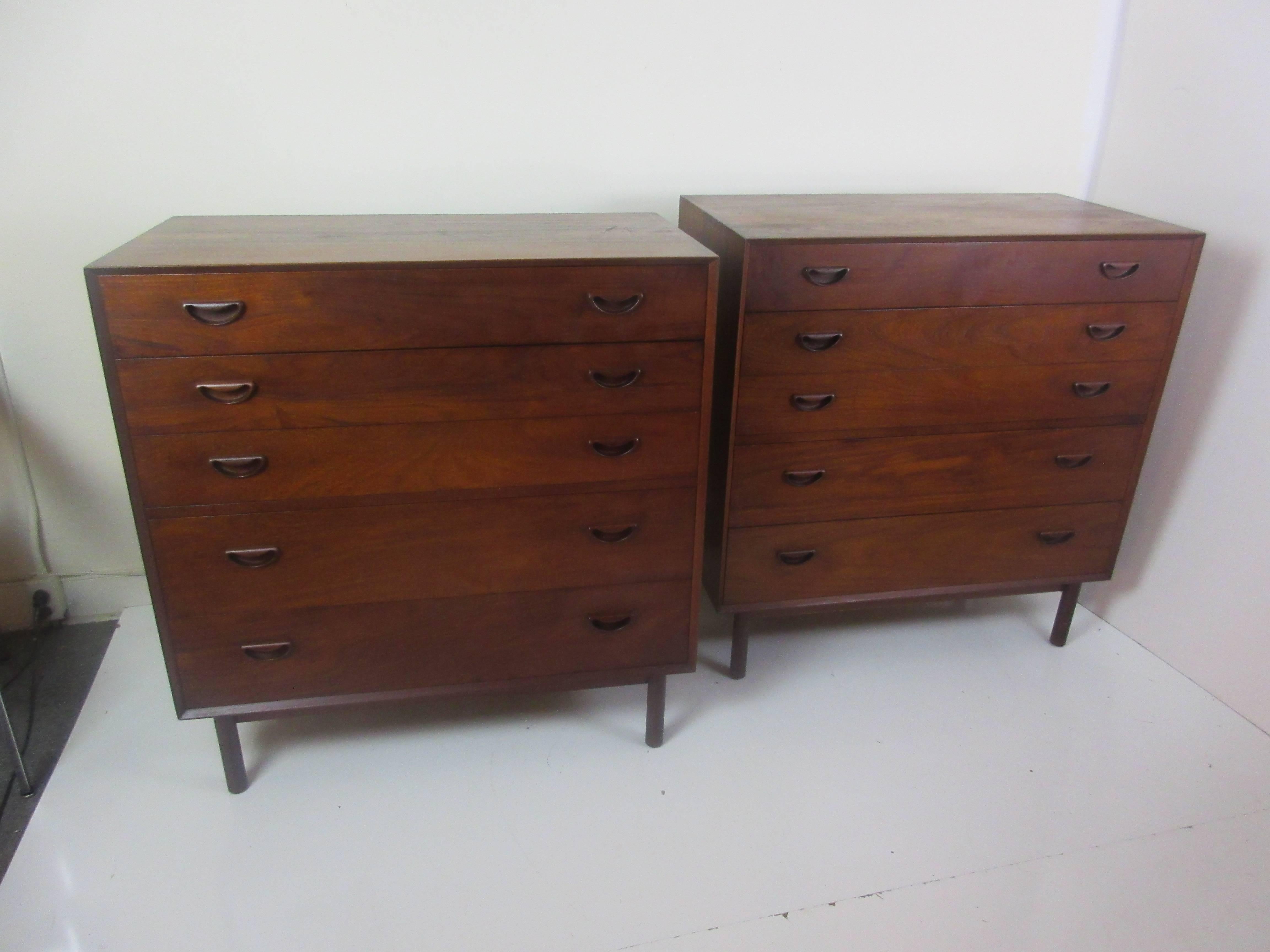 Peter Hvidt solid teak five-drawer chests (two available). Chest have Hvidt's signature tenon construction on all four corners of cabinet. Drawers have two and three separations. One chest has many dents on top.