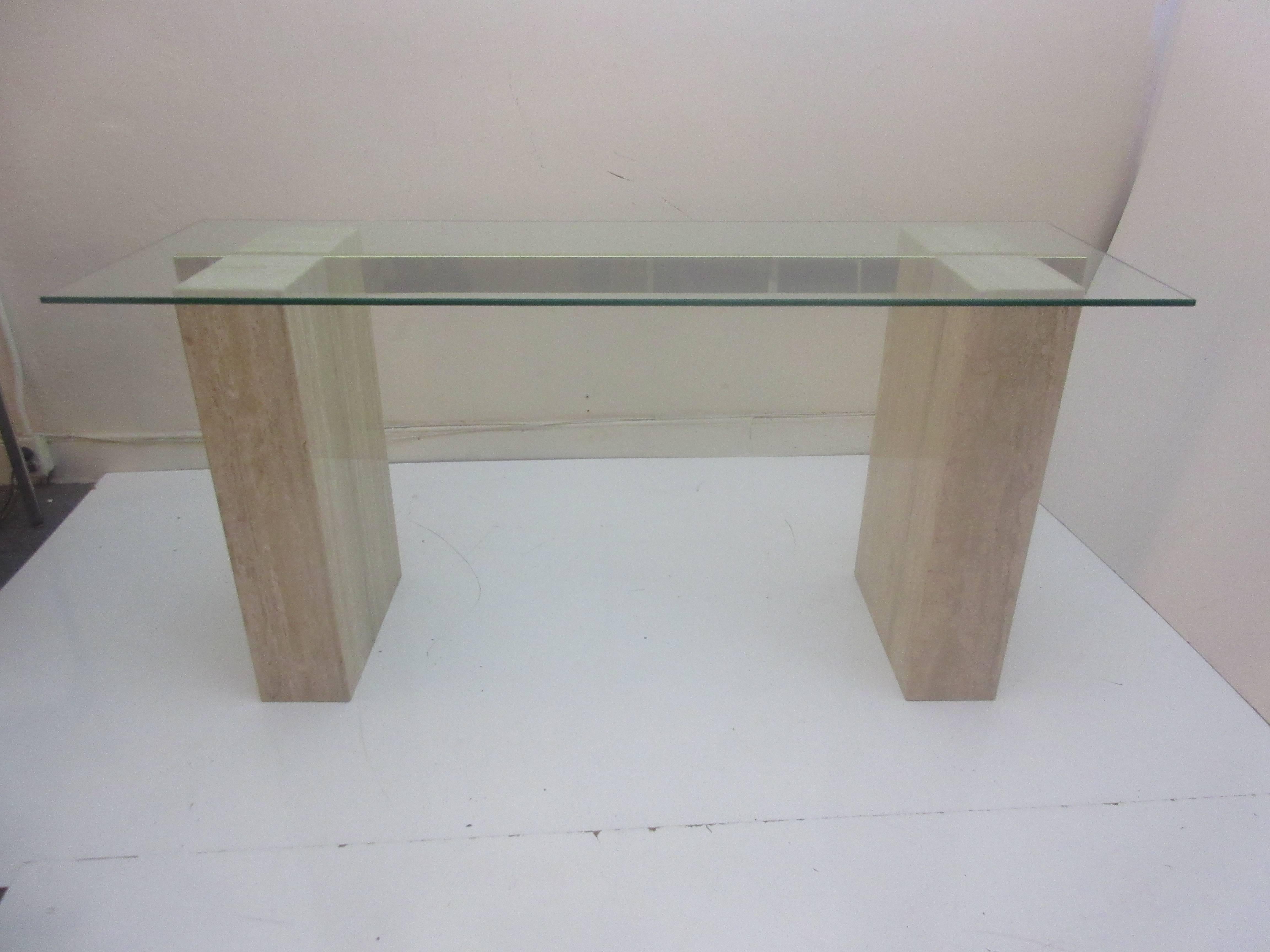 Artendi console table in travertine brass and glass. Elegant console in durable material that can get wet without damage.