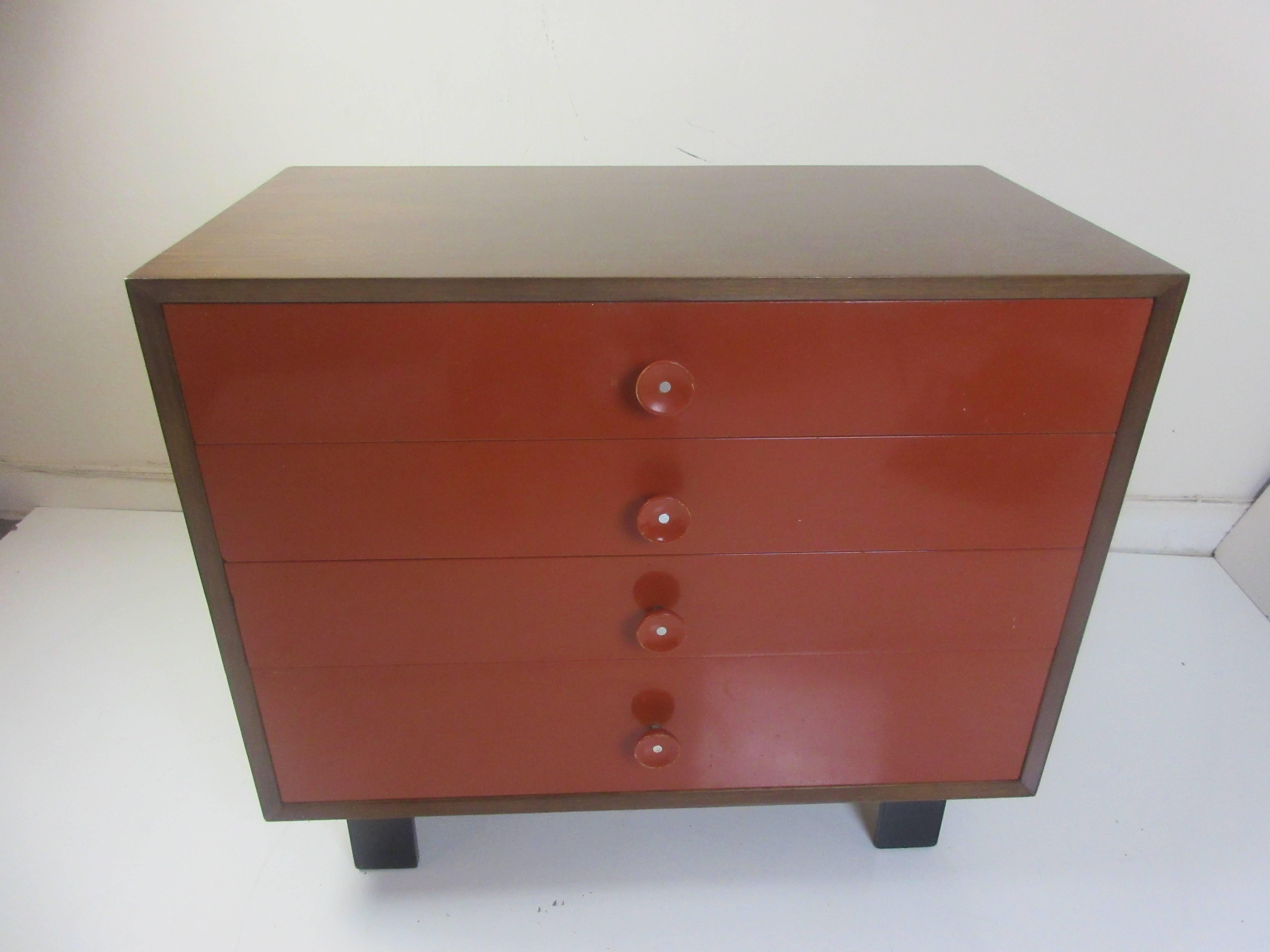 George Nelson for Herman Miller vanity chest of drawers in a walnut case with the original bittersweet red lacquered drawers and the # 6 