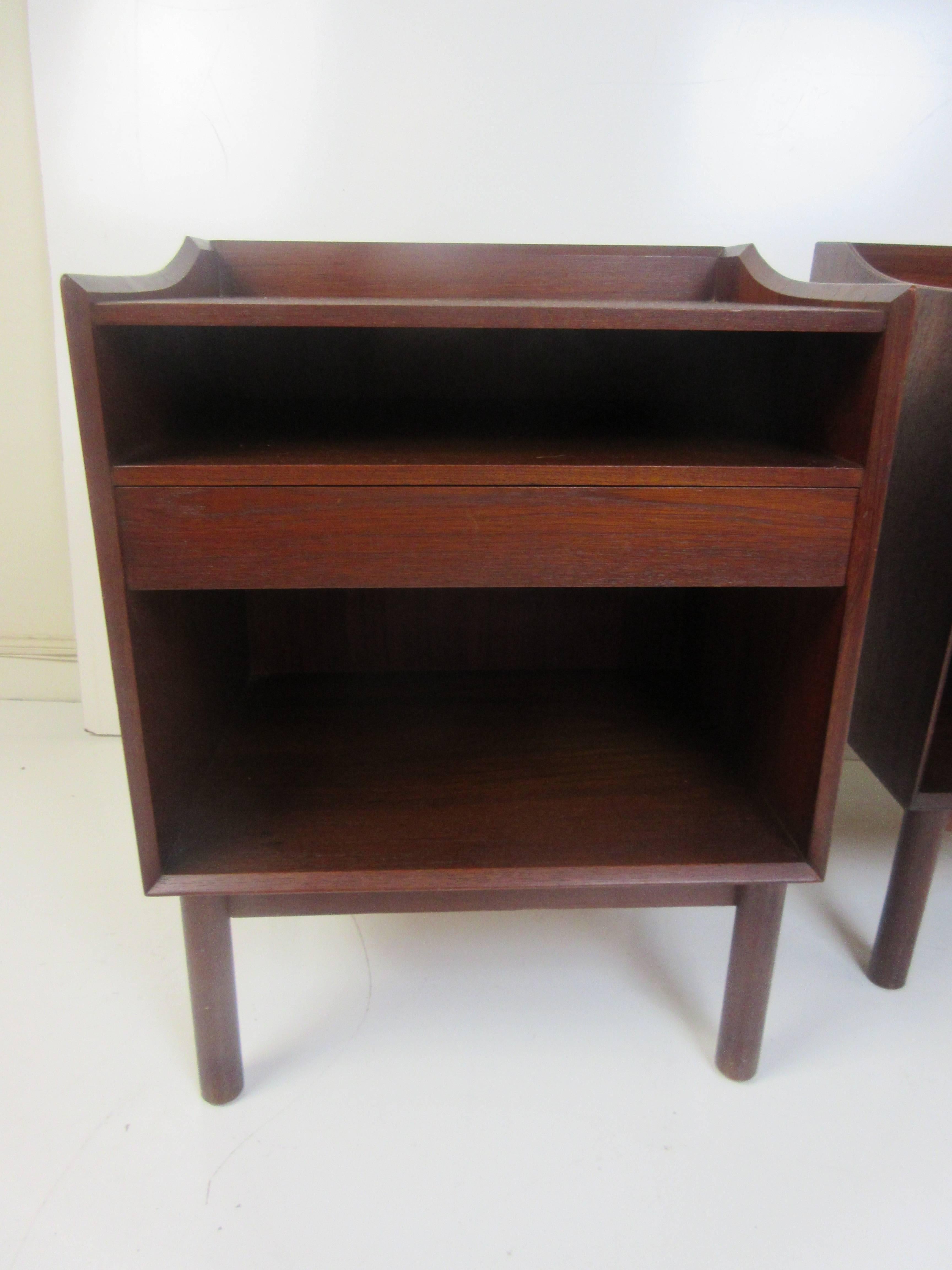 Peter Hvidt nightstands in teak for John Stuart. Petite with open space and drawer with Hvidt's tell tale tenon joinery on the bottom edges of each cabinet. All original condition and bought from the original owne.