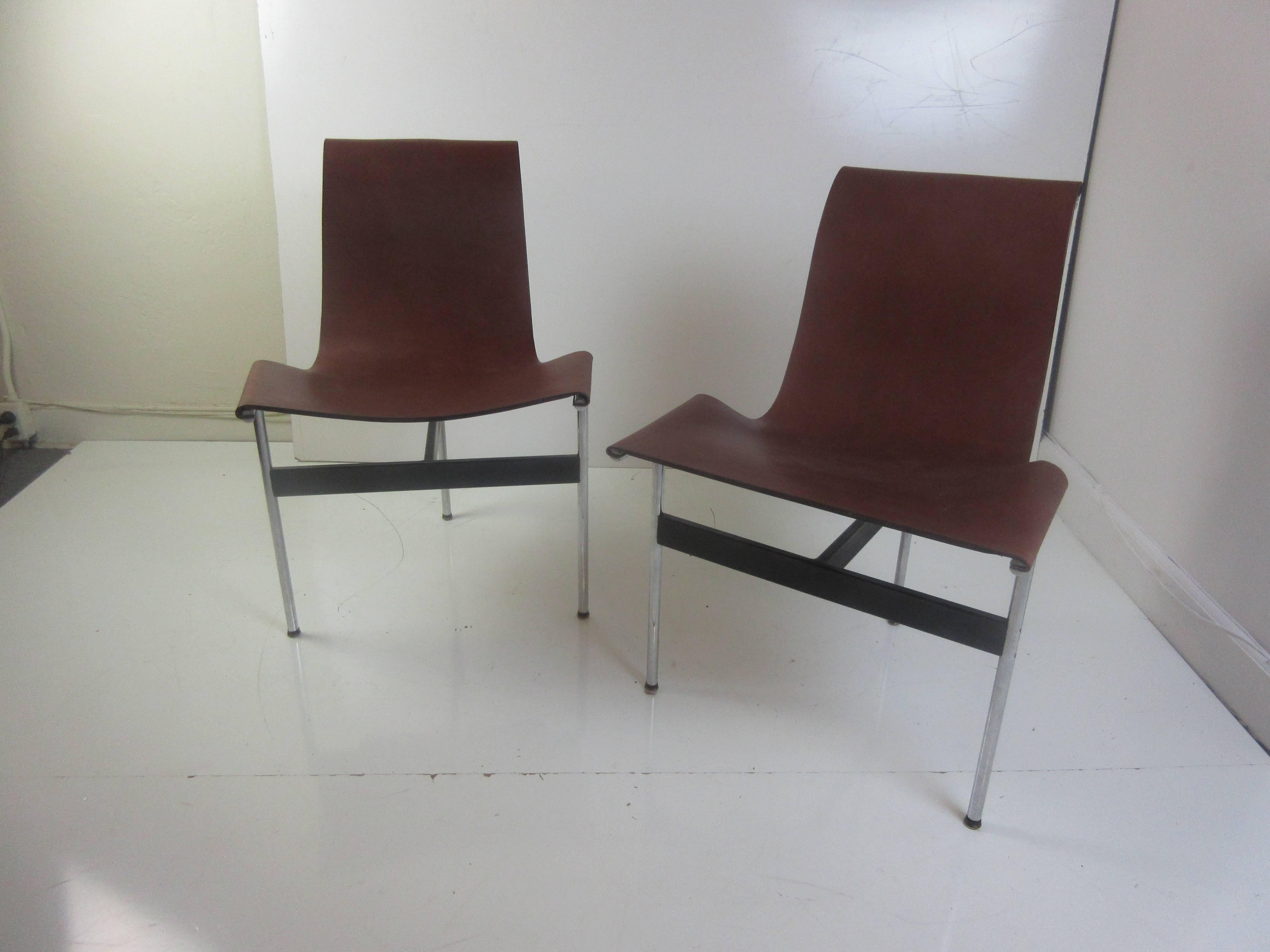 Erwine and Estelle Laverne T dining chairs with new leather slings. Original chrome and painted support in excellent condition. Last pictures show the original slings and original catalog with prices from 1961.