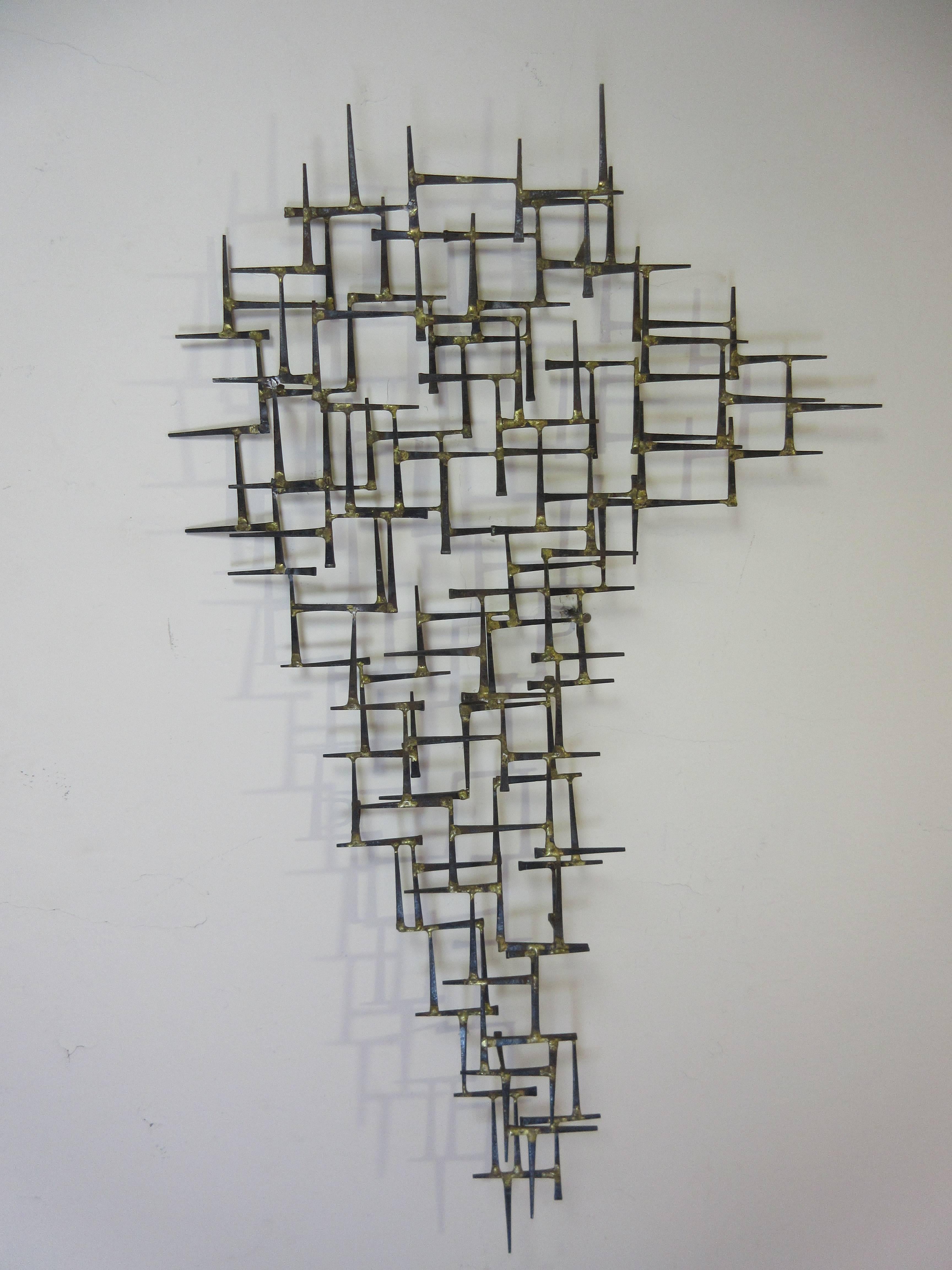 William Bowie nail wall sculpture that can be hung either vertically or horizontally to accommodate your space. Several repairs expertly done.