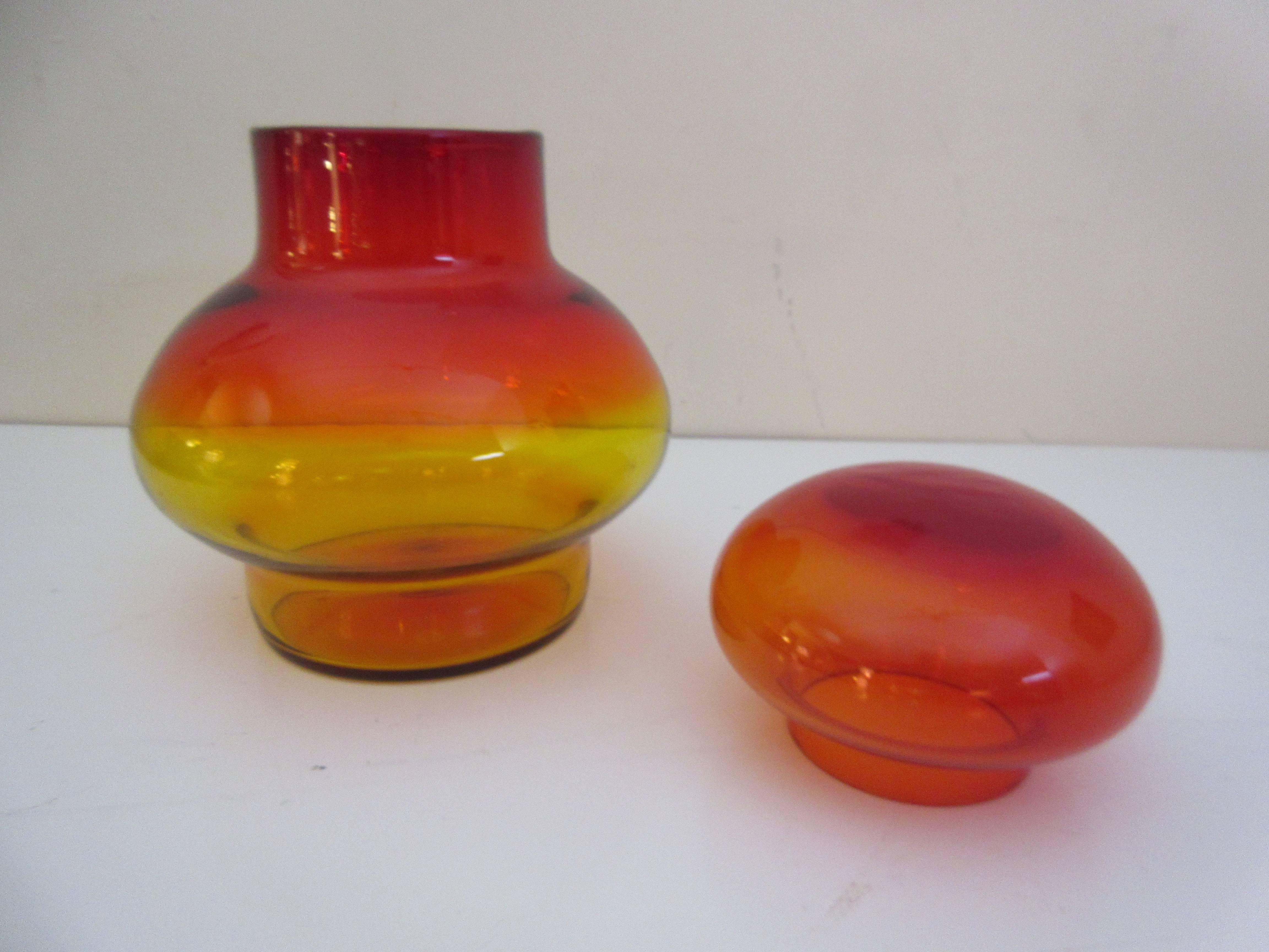 Blenko Amberina covered Jar perfect in every way. The Amberina series coloring goes from a yellow to orange to a bright red by degree.