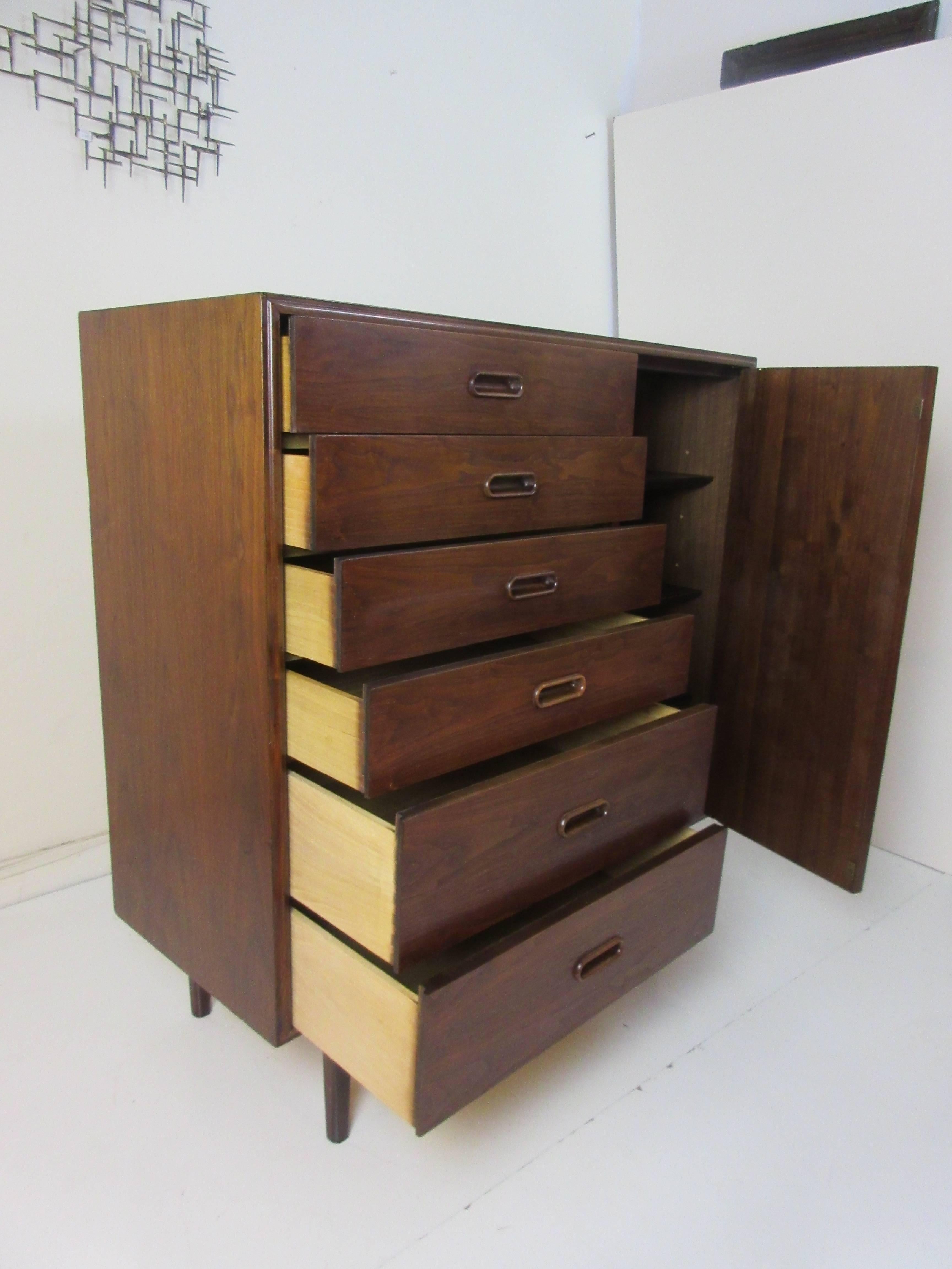 Danish teak chest with six drawers and adjustable shelving behind the door.  Right side reveals adjustable shelves perfect for bulky sweaters!