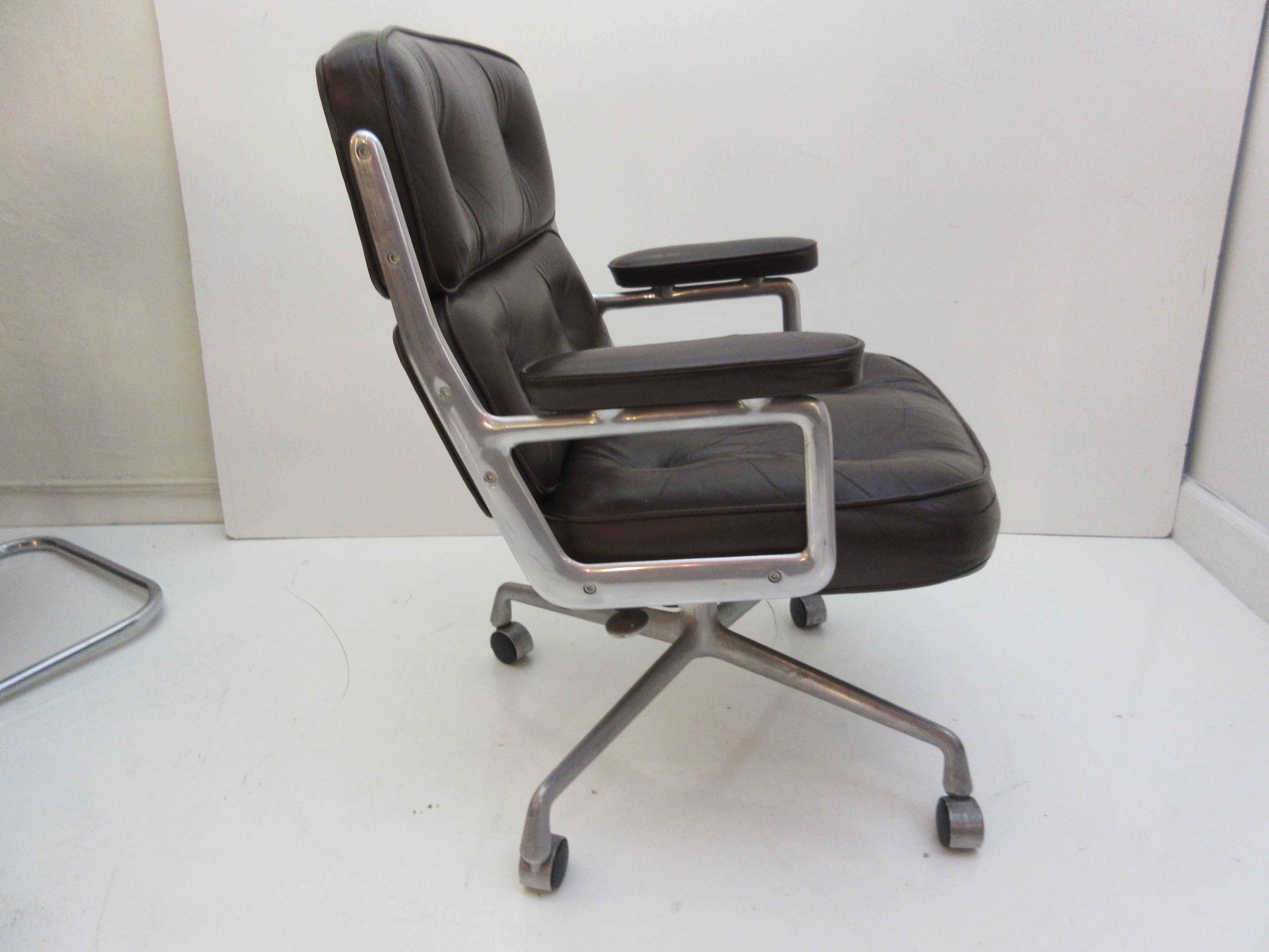 Charles and Ray Eames Time Life Chair by Herman Miller from 1969 in chocolate leather. Chair has both screw type height adjustment and tilt back mechanism. Leather is in remarkably good original condition with no stains or holes. One arm has a slit