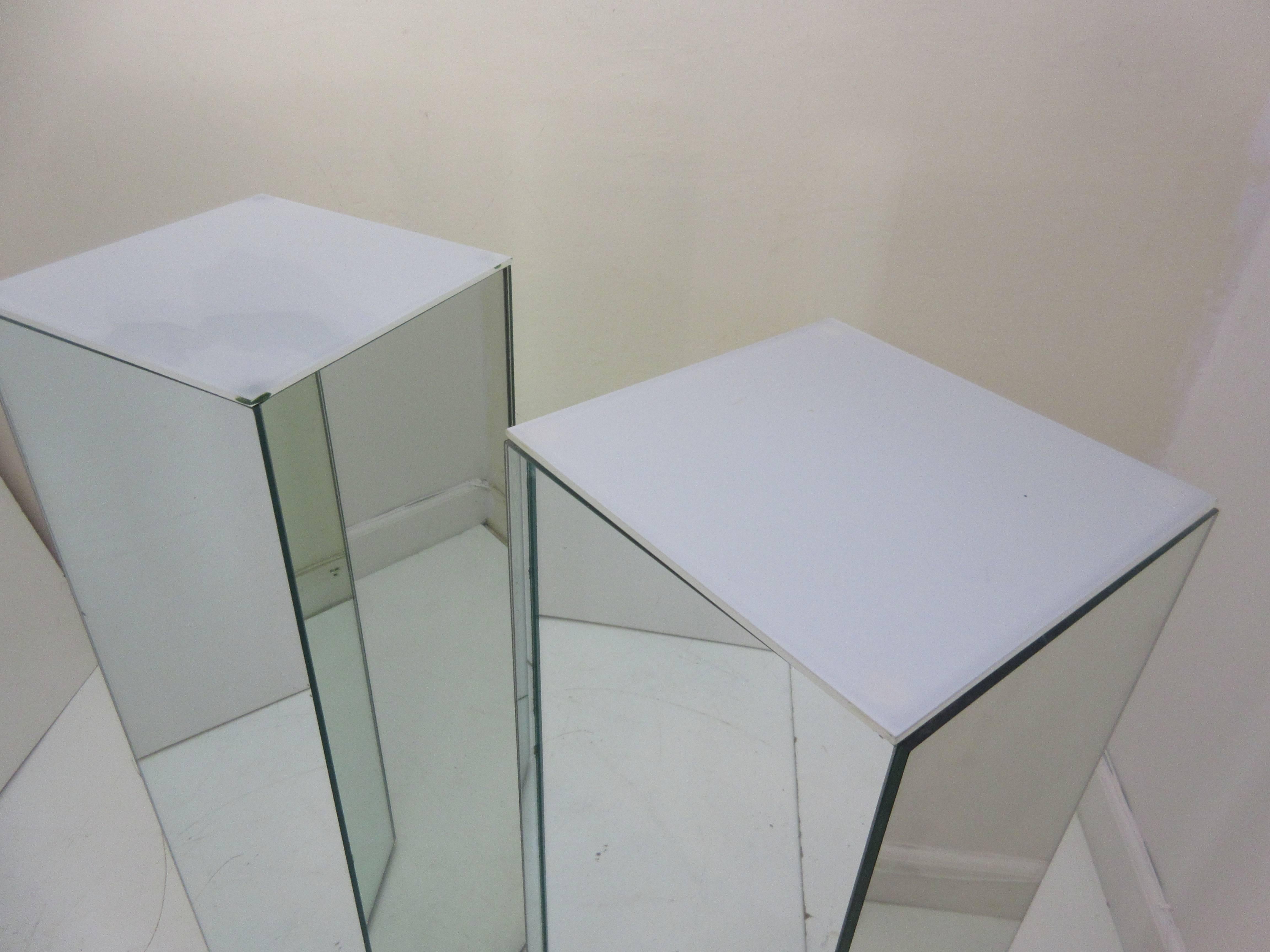 Individually priced, two available 1970s lighted pedestals. Four-sided mirrored columns with frosted tops. Switches in line allow for easy on off. Photo shows lit and unlit options.