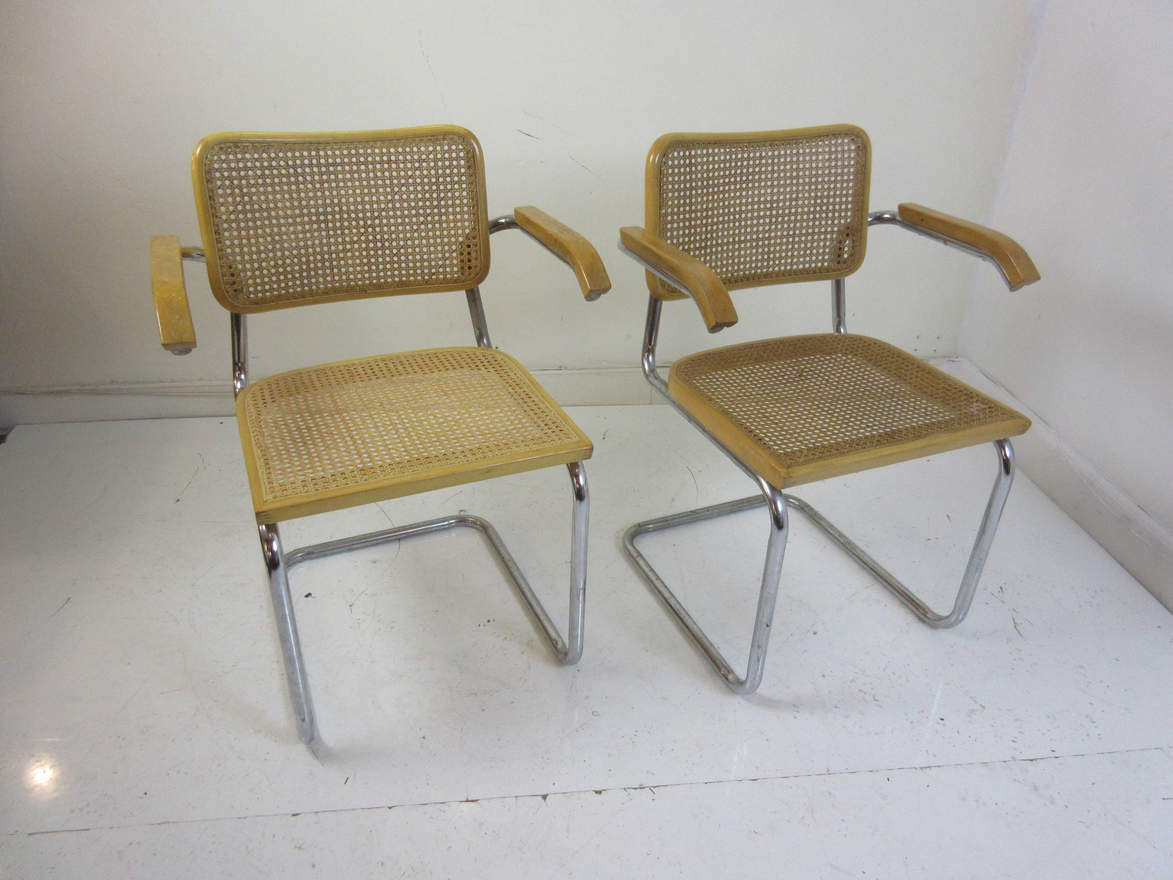 Marcel Breuer Cesca armchair by Gavina distributed by Knoll. These chairs are 1960s editions and are birch with chrome frames and canned seat and back rests. Chairs retain Made in Italy labels.