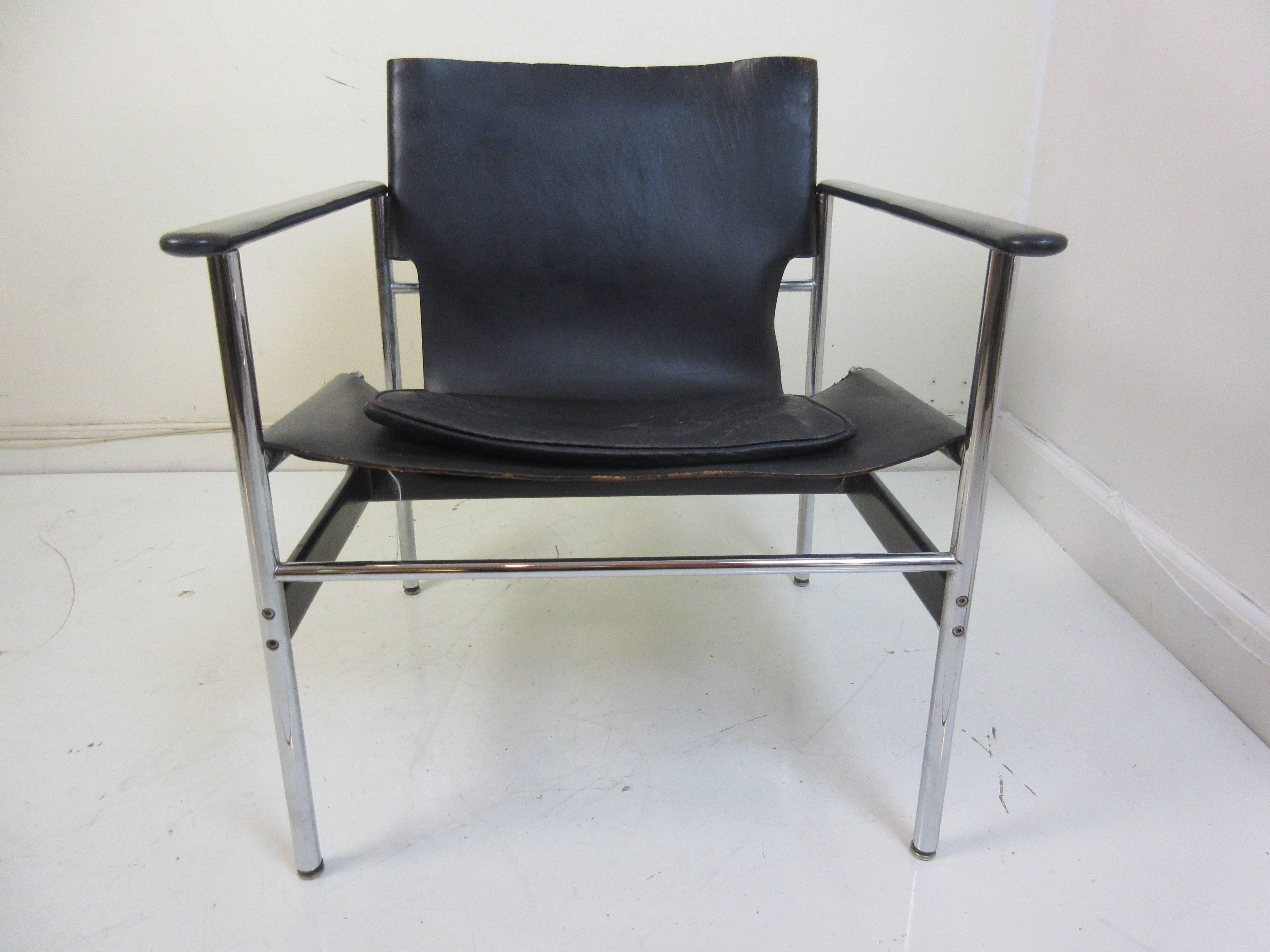 Charles Pollack 657 Knoll sling chair in black totally original and dated Jan 1978. Normal 40 year wear to leather and excellent chrome and plastic arm rests are perfect.