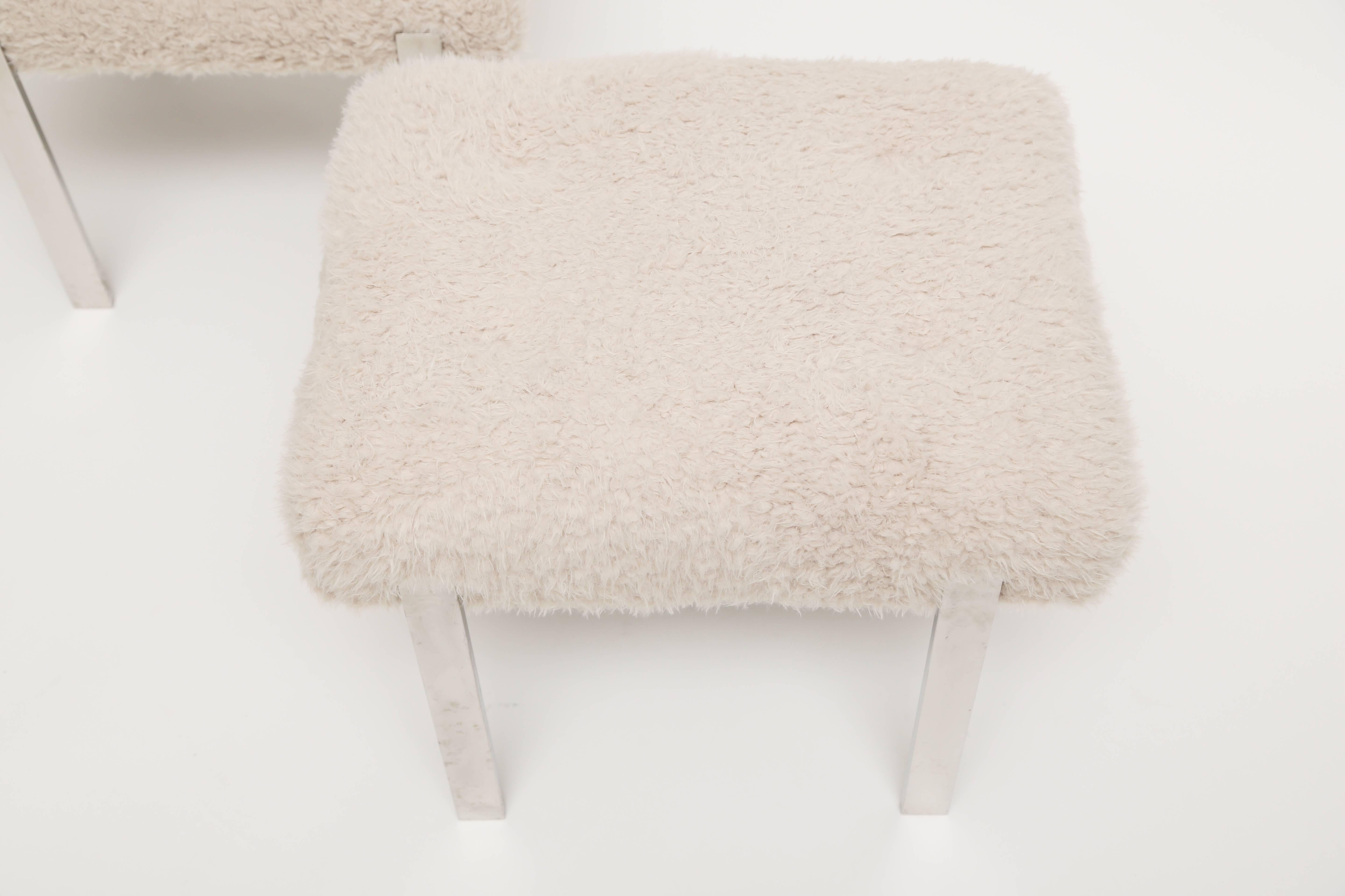 Pair of Harvey Probber Minimalist flat-bar steel ottomans.
Reupholstered in faux fur fabric.